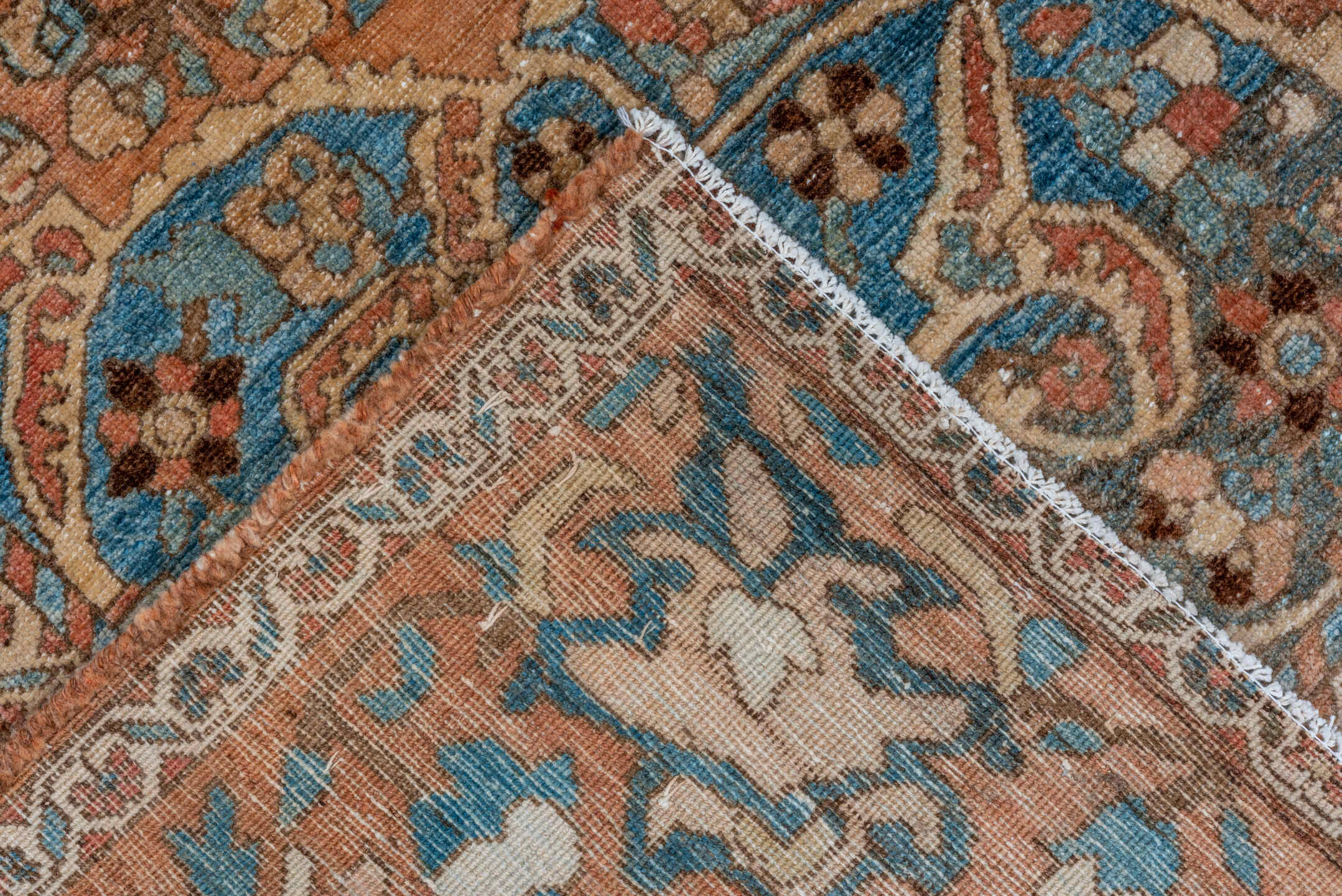 7' x 9' one-of-a-kind handmade vintage Baktiary rug. Color palette: terra cotta, sky blue, ivory, brown, camel, slate