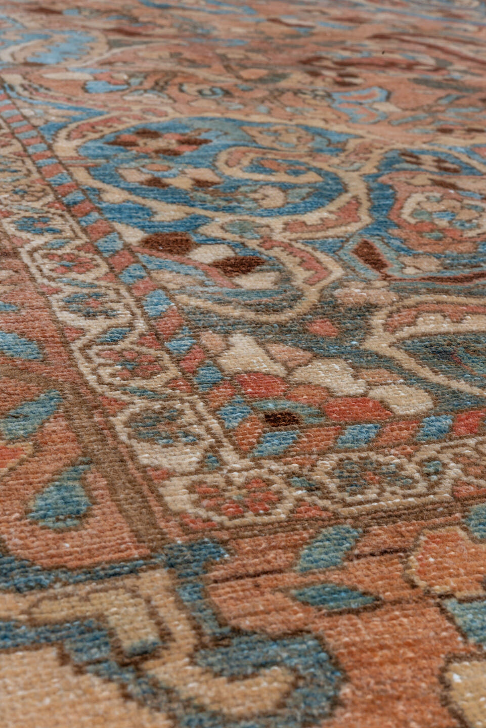 7' x 9' one-of-a-kind handmade vintage Baktiary rug. Color palette: terra cotta, sky blue, ivory, brown, camel, slate
