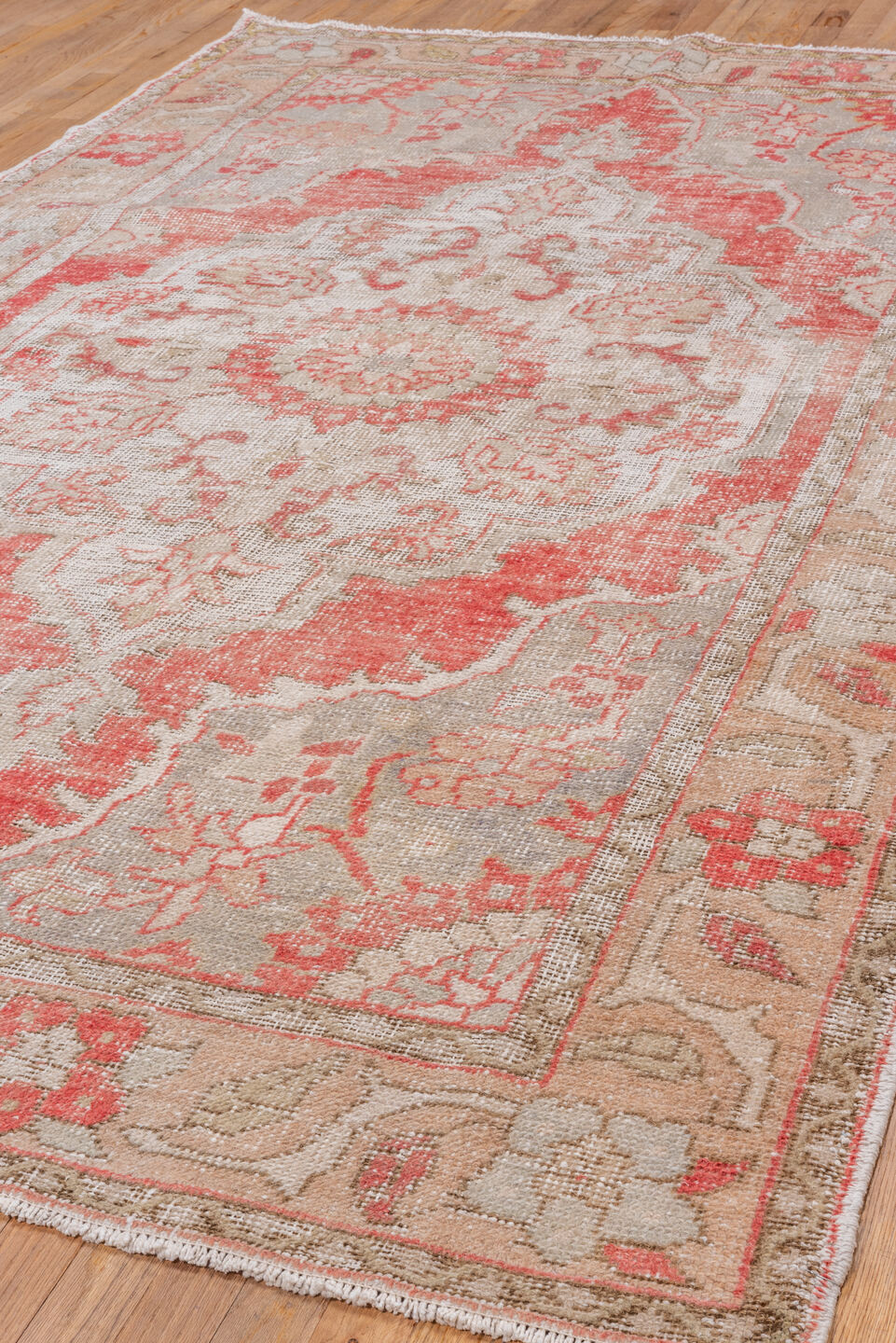 5' x 9' one-of-a-kind handmade vintage Oushak medium size rug. Color palette: gray, light gray, off-white, pink, red