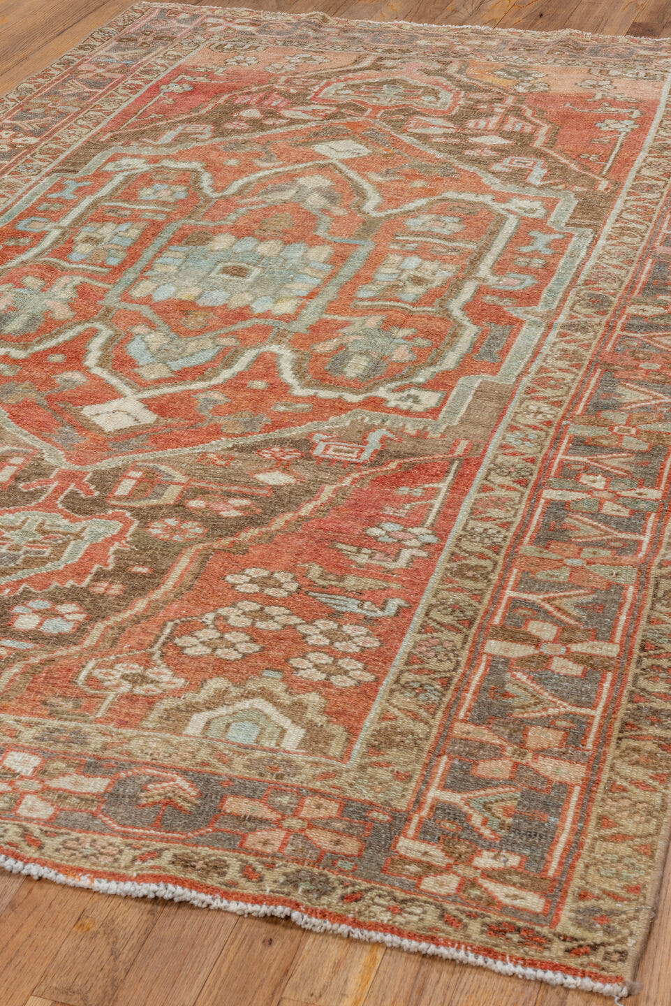 4' x 7' one-of-a-kind handmade vintage Serapi rug. Color palette: terra cotta, rust, slate, ivory, taupe, charcoal, camel