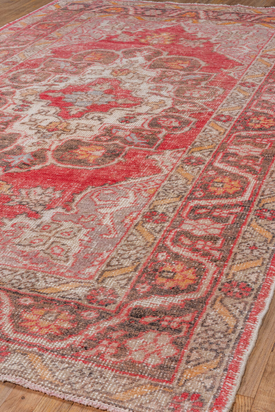 5' x 8' one-of-a-kind handmade vintage Oushak medium size rug. Color palette: coral, ivory, charcoal, gold, rose, taupe
