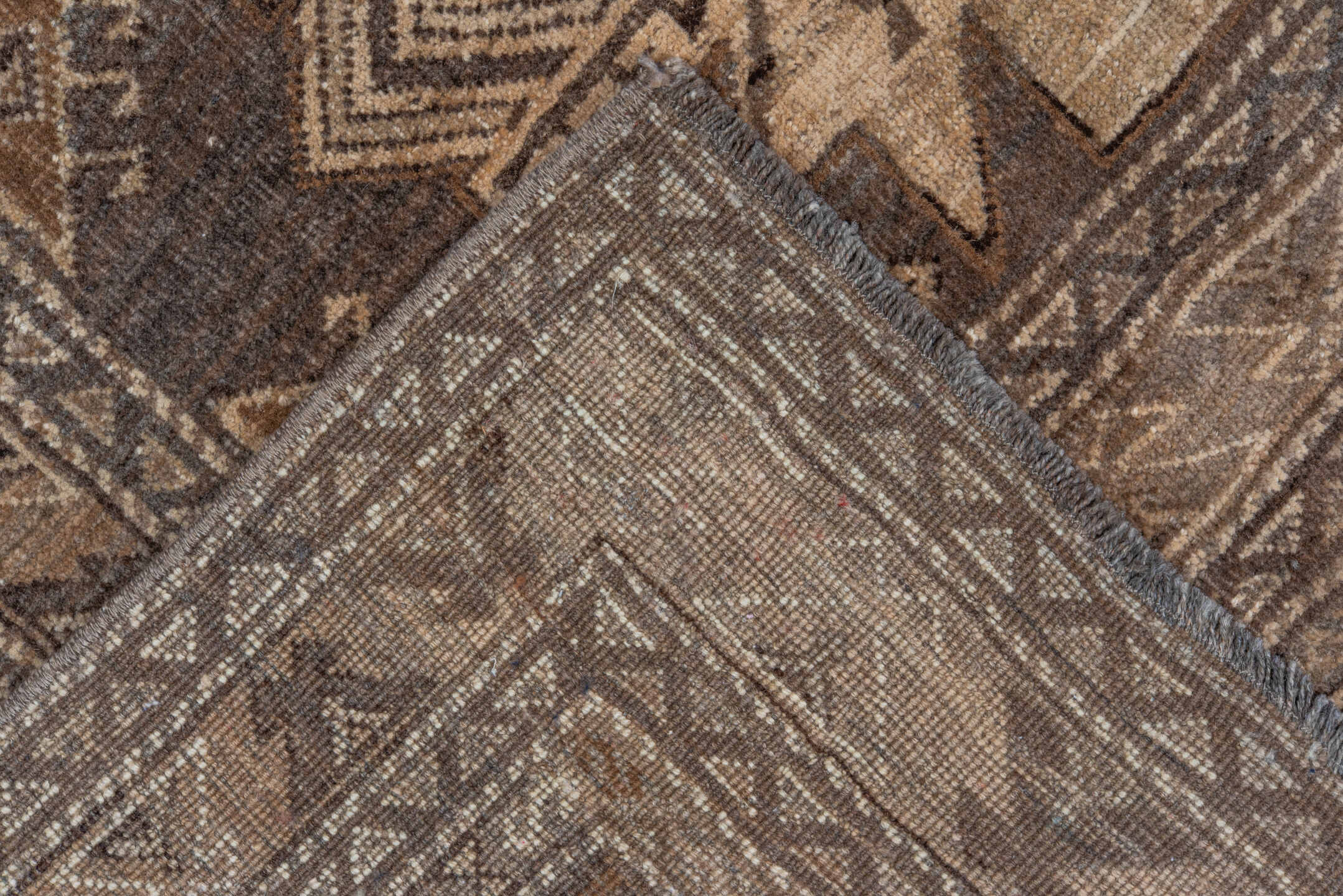 7' x 9' one-of-a-kind handmade vintage Afghan rug. Color palette: taupe, brown, ivory, charcoal, camel, beige, gray, black
