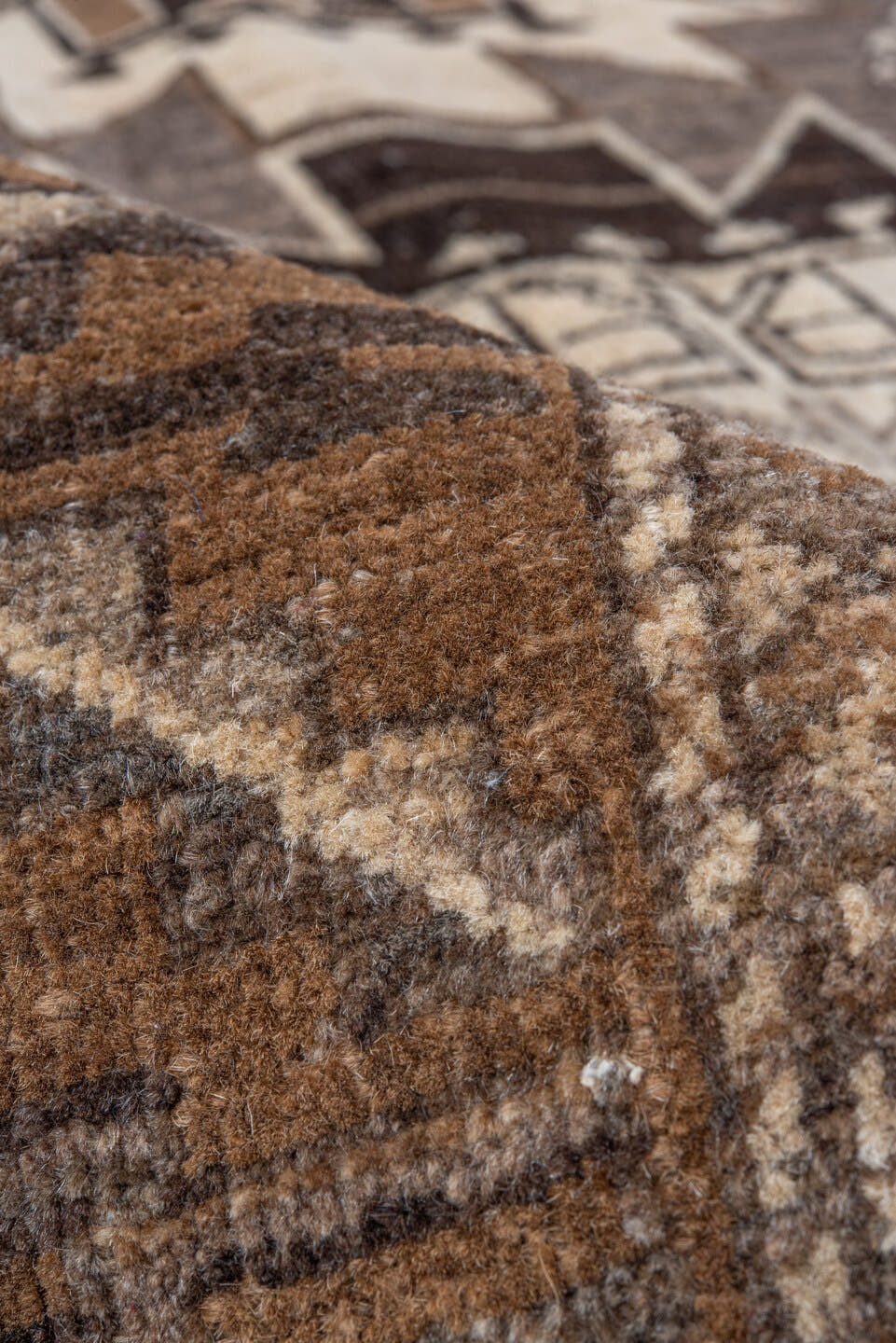 7' x 9' one-of-a-kind handmade vintage Afghan rug. Color palette: taupe, brown, ivory, charcoal, camel, beige, gray, black