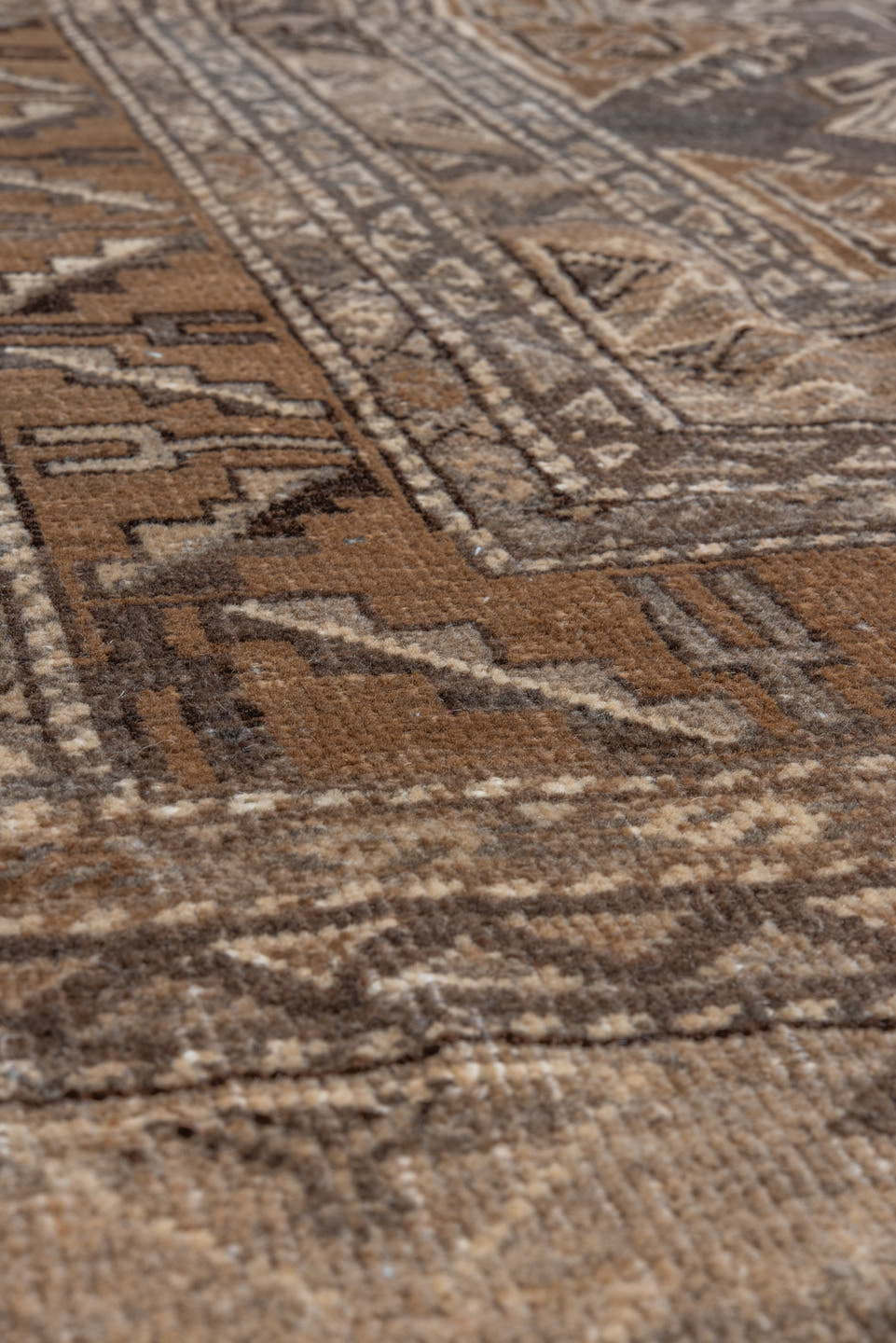 7' x 9' one-of-a-kind handmade vintage Afghan rug. Color palette: taupe, brown, ivory, charcoal, camel, beige, gray, black