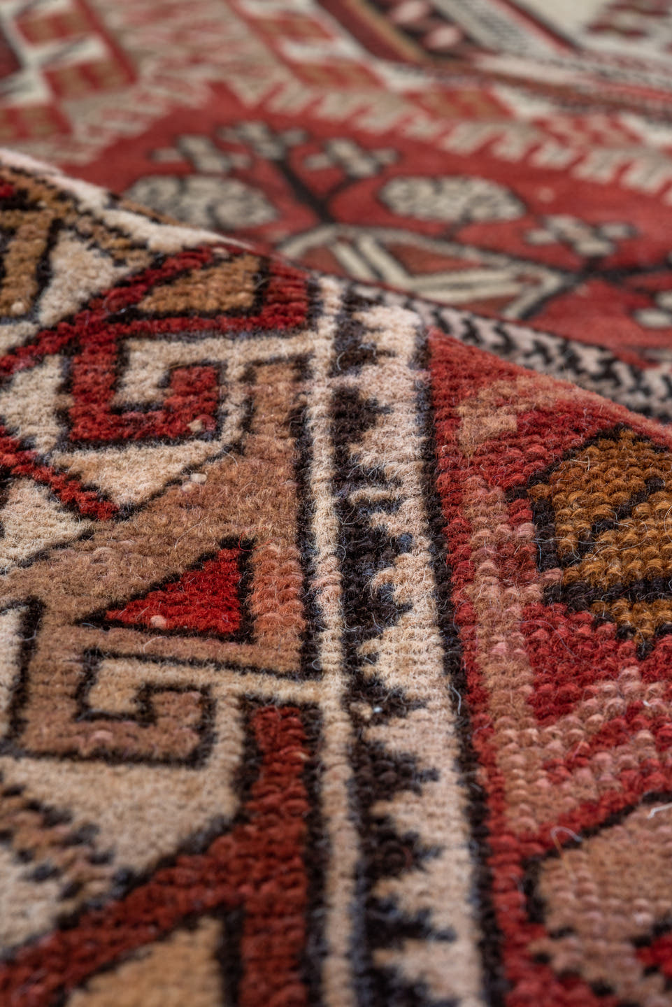 4' x 7' one-of-a-kind handmade vintage Shirvan rug. Color palette: ivory, crimson, charcoal, camel, taupe, mahogany, red