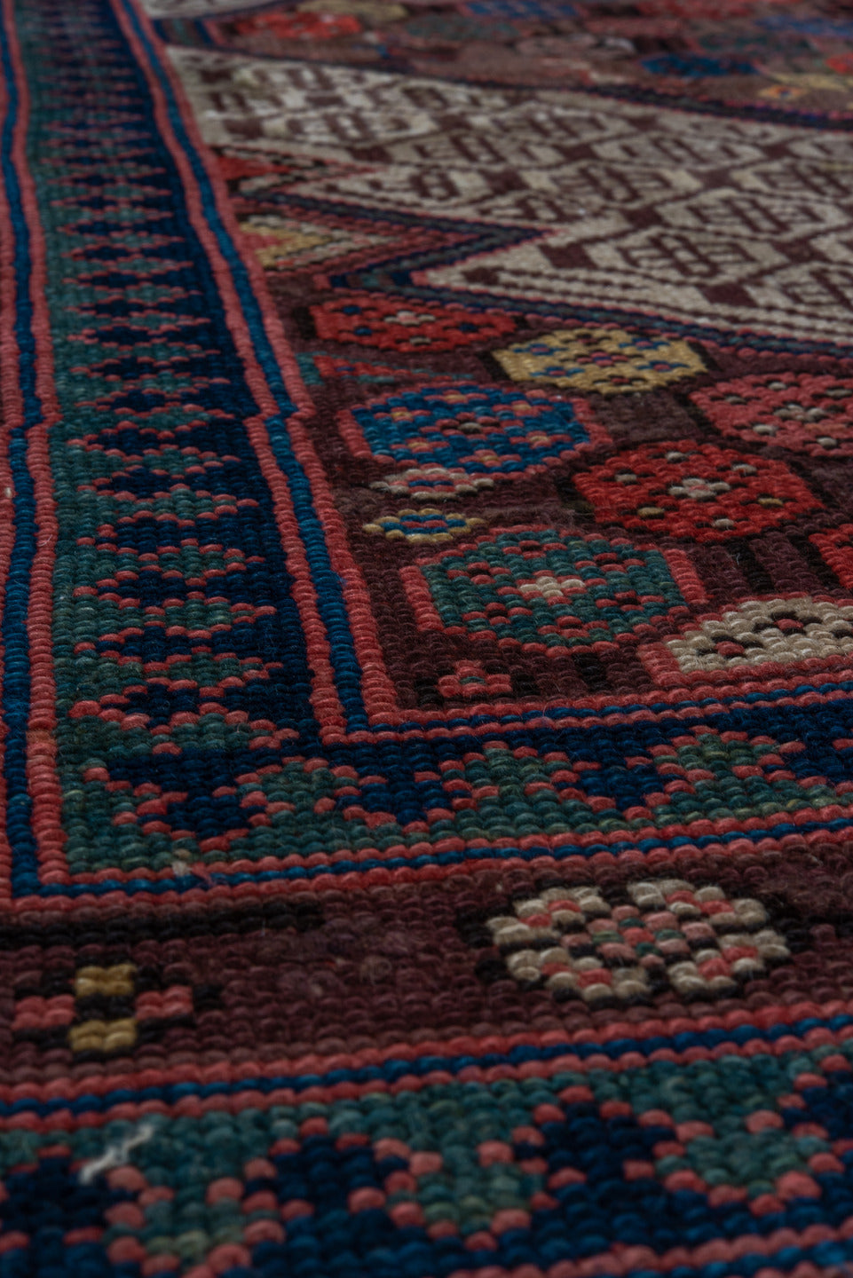 4' x 10' one-of-a-kind handmade vintage Cam Hamadan runner rug. Color palette: black, blue, brown, gray, pink, red, wine