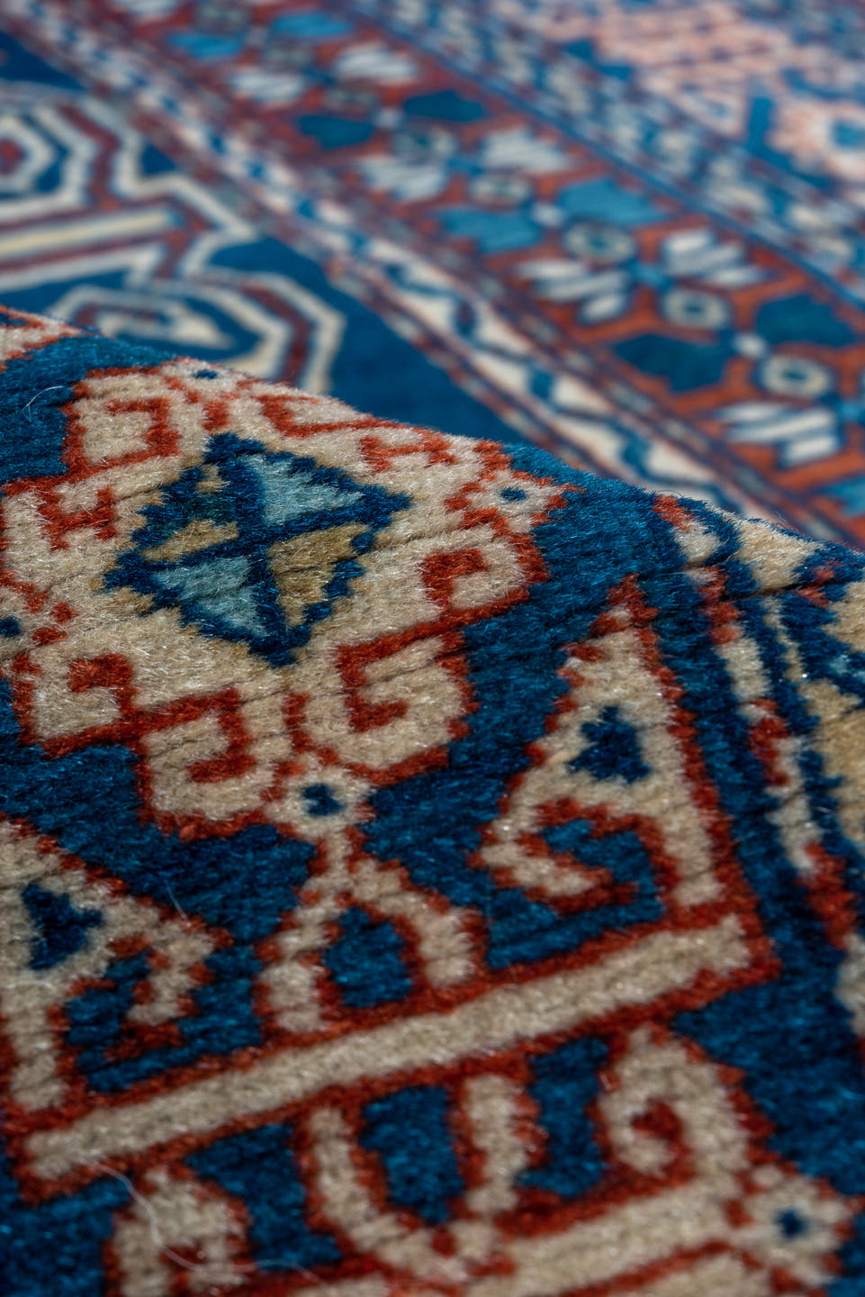 4' x 5' one-of-a-kind handmade vintage Shirvan small size rug. Color palette: navy, ivory, rust, sky_blue, crimson, camel