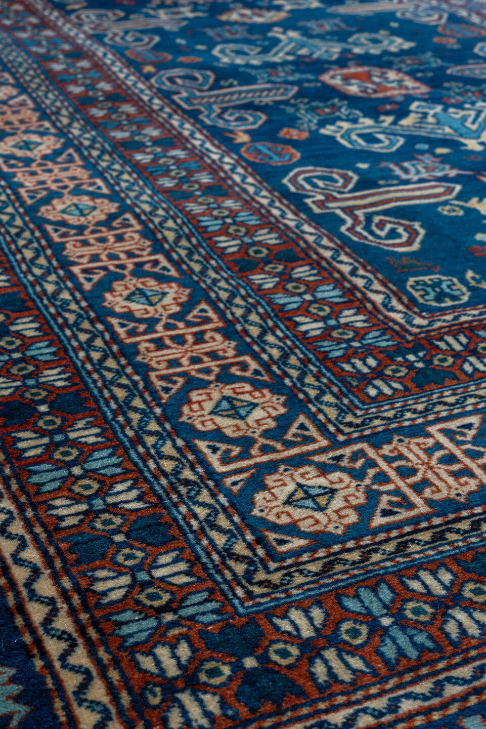 4' x 5' one-of-a-kind handmade vintage Shirvan small size rug. Color palette: navy, ivory, rust, sky_blue, crimson, camel