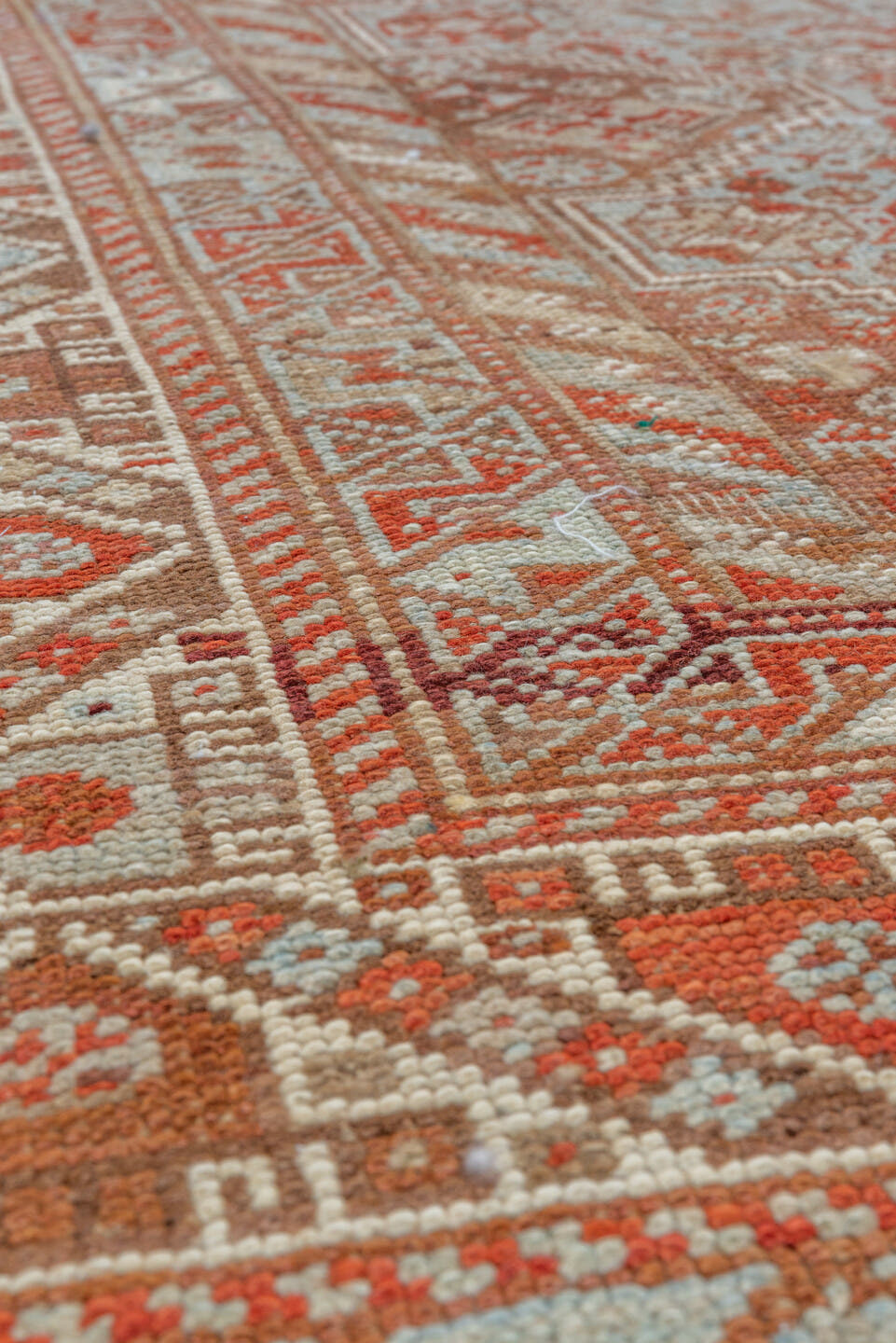 7' x 10' one-of-a-kind handmade vintage Shiraz large size rug. Color palette: rust, ivory, terra cotta, sky blue, camel