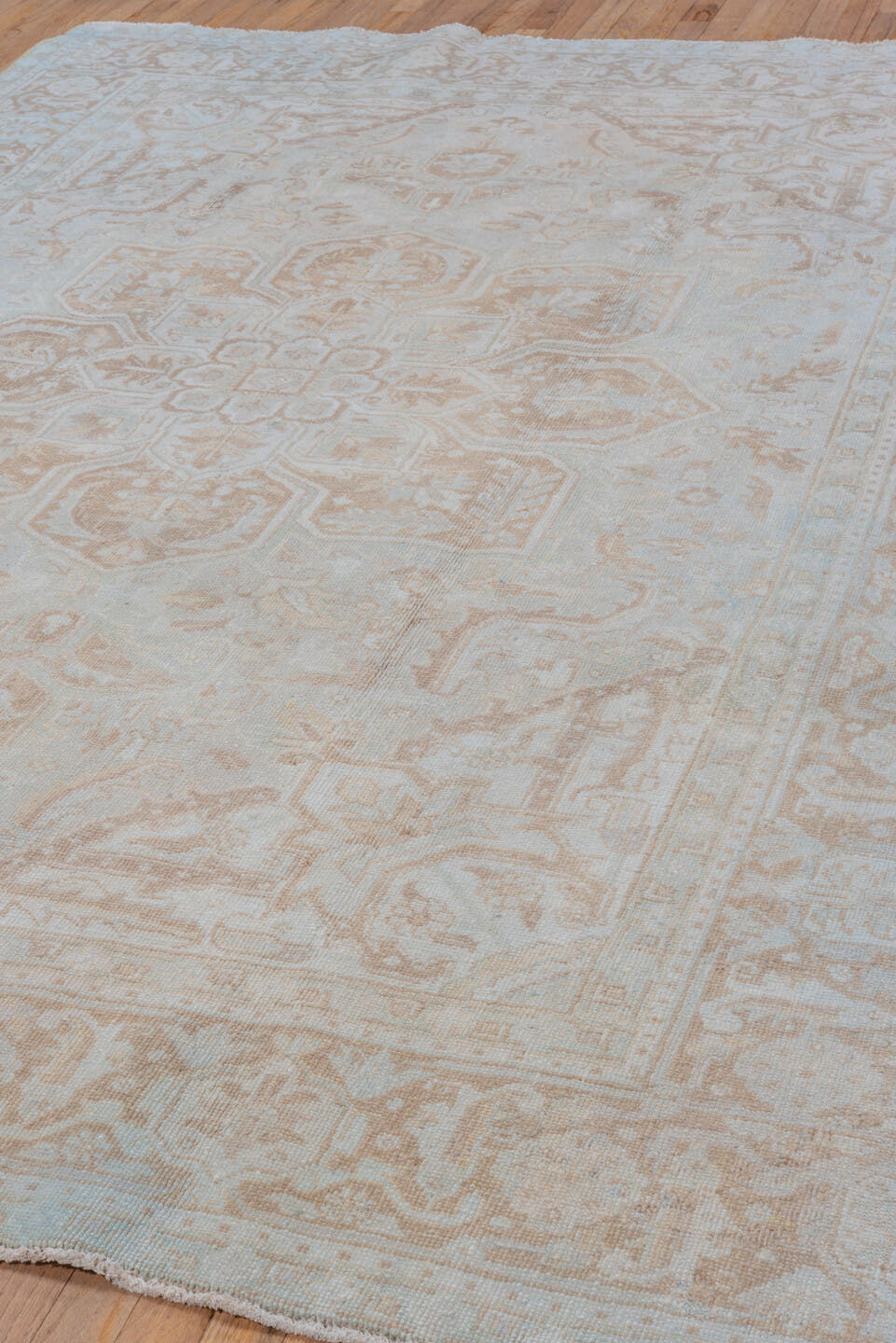 7' x 9' one-of-a-kind handmade vintage Heriz rug. Color palette: ivory, beige, taupe, camel, pale blue, gray, light blue