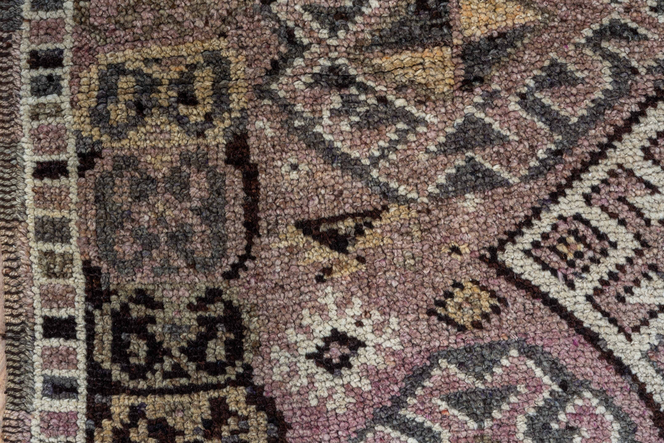 4' x 5' one-of-a-kind handmade vintage Kars small size rug. Color palette: black, brown, charcoal, gray, light gray, pink