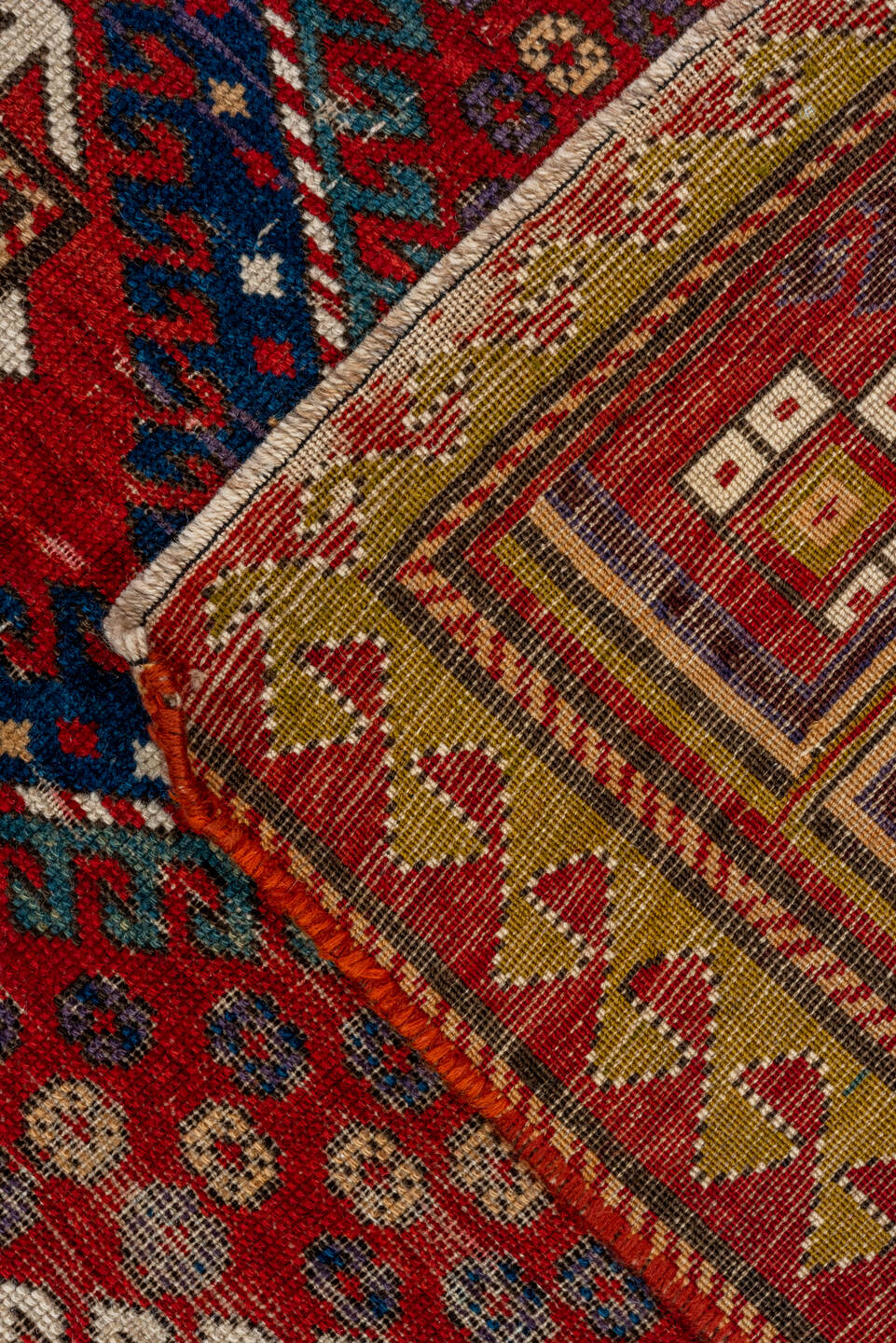 5' x 7' one-of-a-kind handmade vintage Kazak rug. Color palette: red, ivory, navy, olive, gold, rust, sky_blue, brown, blue