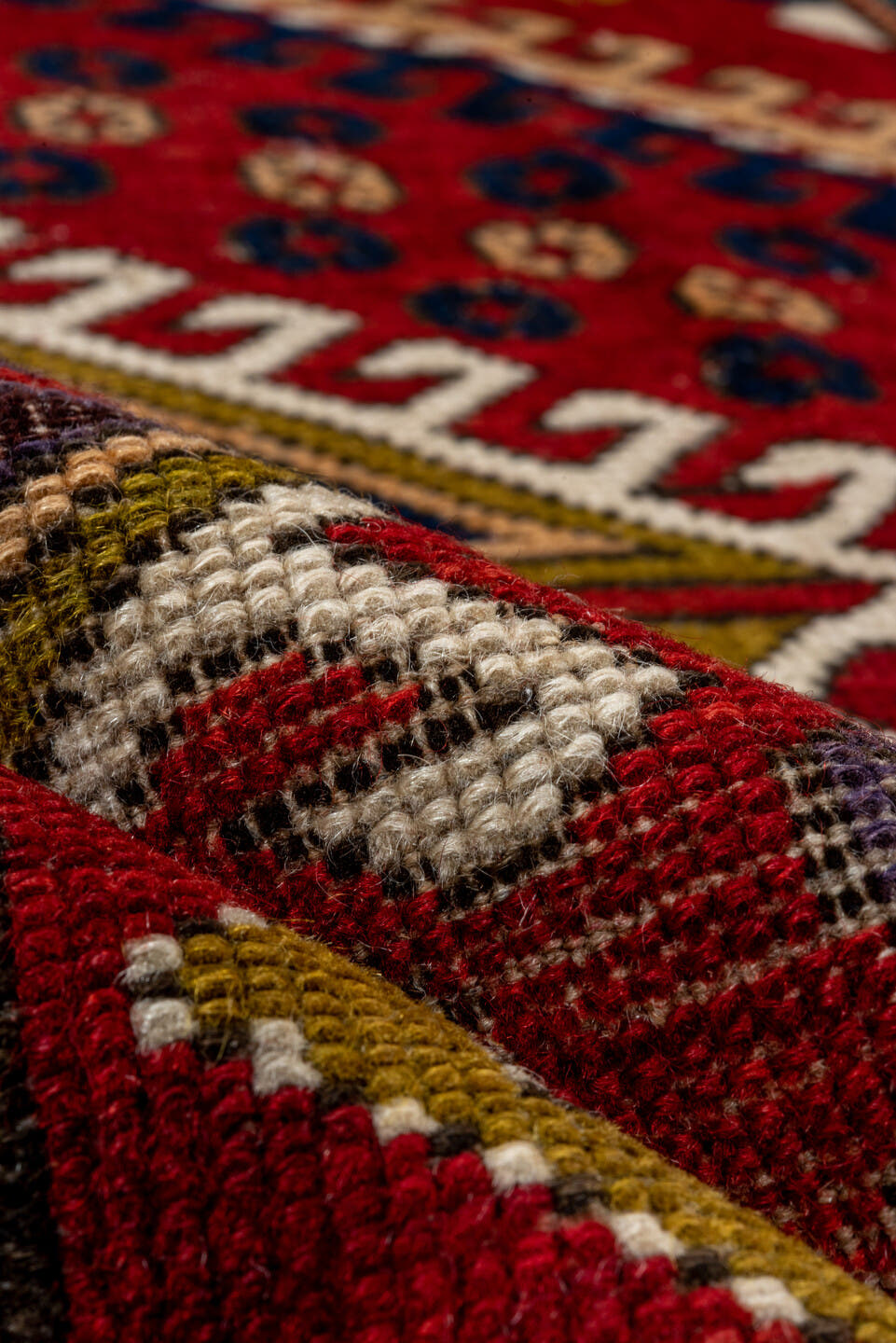 5' x 7' one-of-a-kind handmade vintage Kazak rug. Color palette: red, ivory, navy, olive, gold, rust, sky_blue, brown, blue