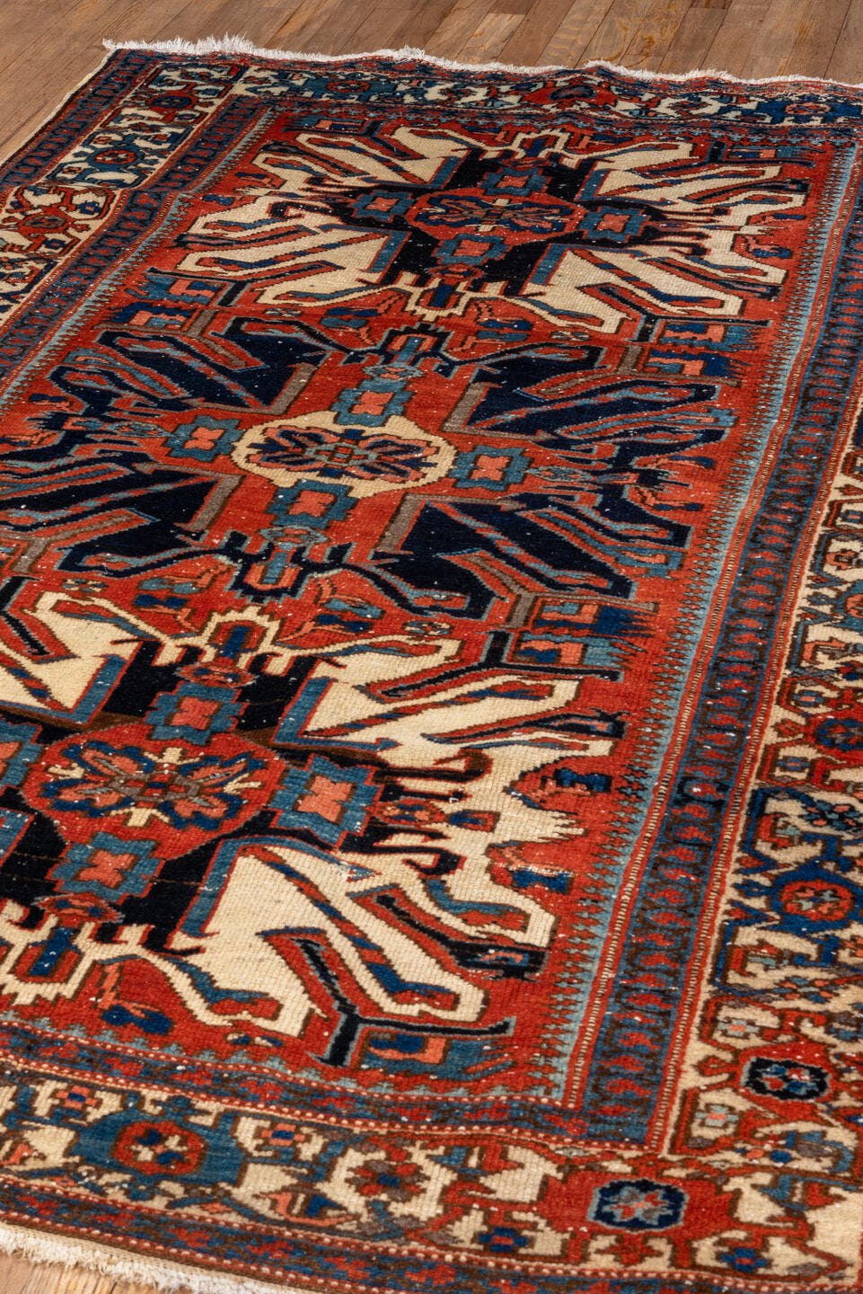 4' x 7' one-of-a-kind handmade vintage Heriz rug. Color palette: rust, ivory, navy, sky_blue, terracotta, charcoal, brown