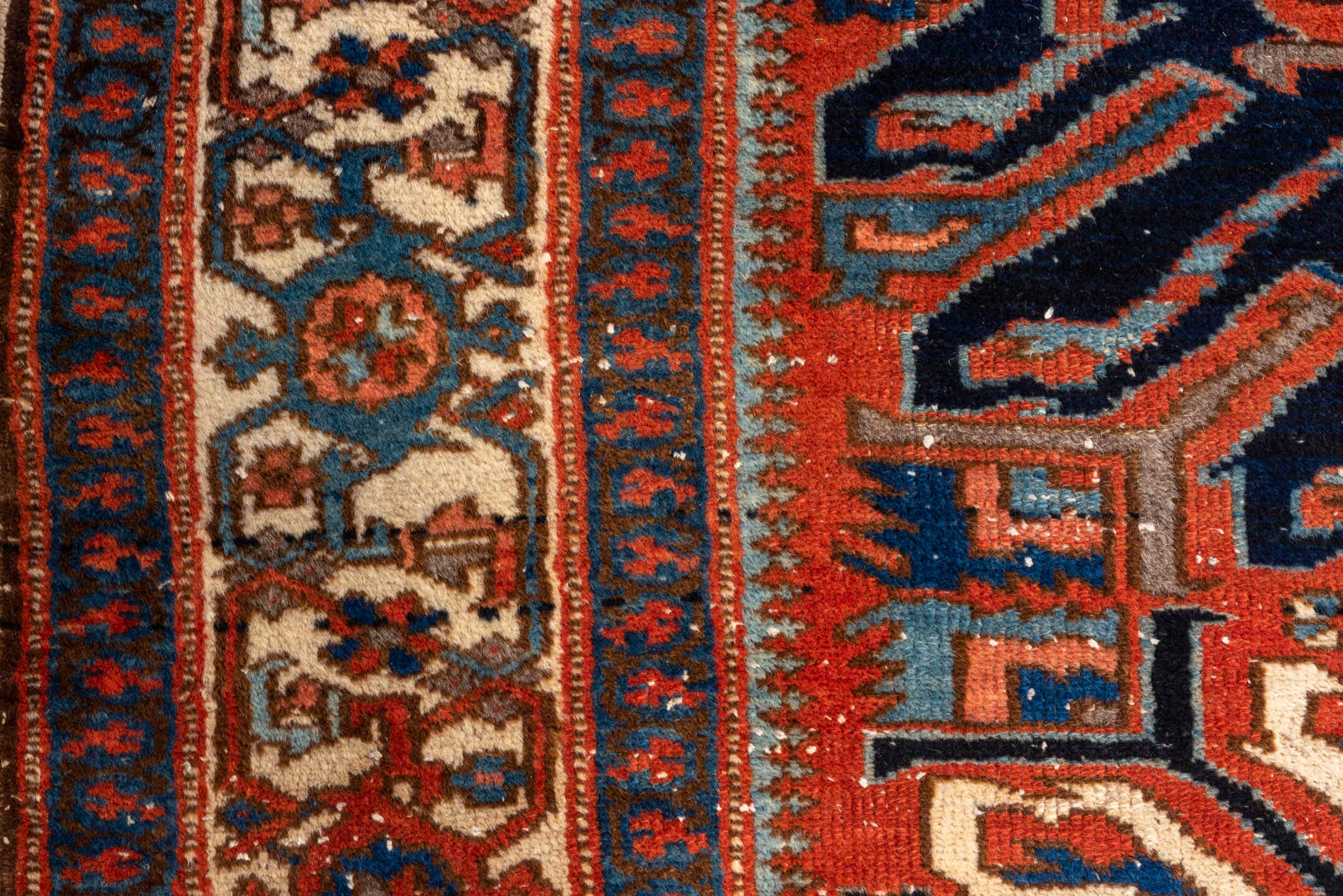 4' x 7' one-of-a-kind handmade vintage Heriz rug. Color palette: rust, ivory, navy, sky_blue, terracotta, charcoal, brown