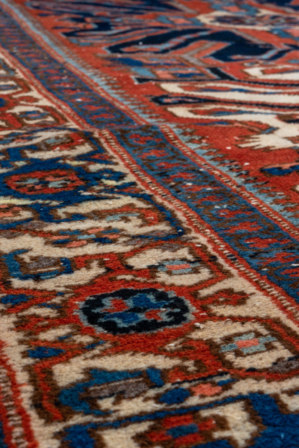 4' x 7' one-of-a-kind handmade vintage Heriz rug. Color palette: rust, ivory, navy, sky_blue, terracotta, charcoal, brown