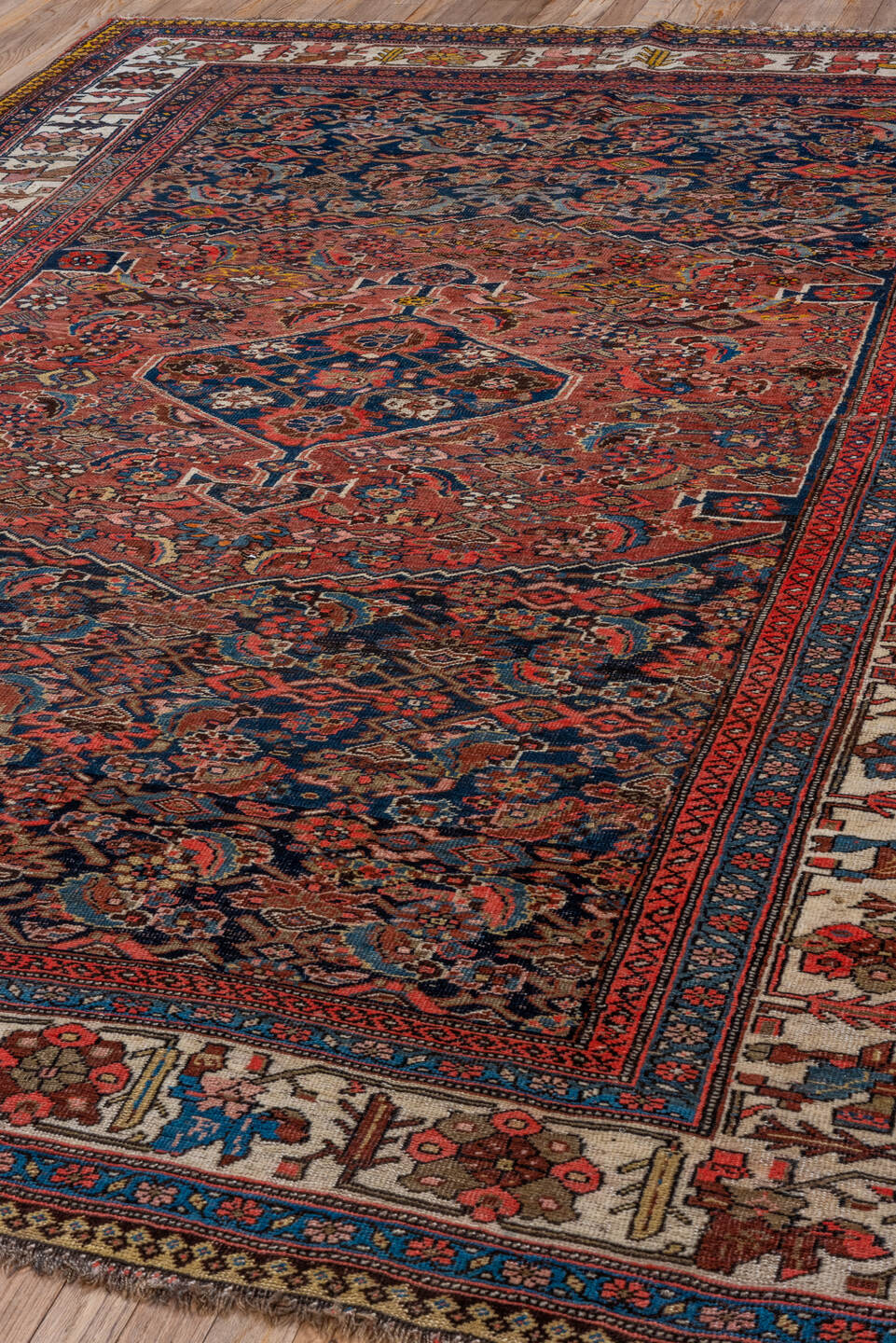 6' x 9' one-of-a-kind handmade vintage Bidjar medium size rug. Color palette: navy, rust, ivory, red, coral, blue, gold