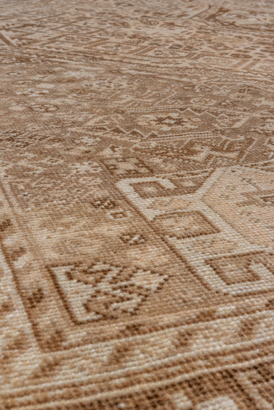 7' x 9' one-of-a-kind handmade vintage Shiraz rug. Color palette: camel, ivory, taupe, brown, sand, beige, gray