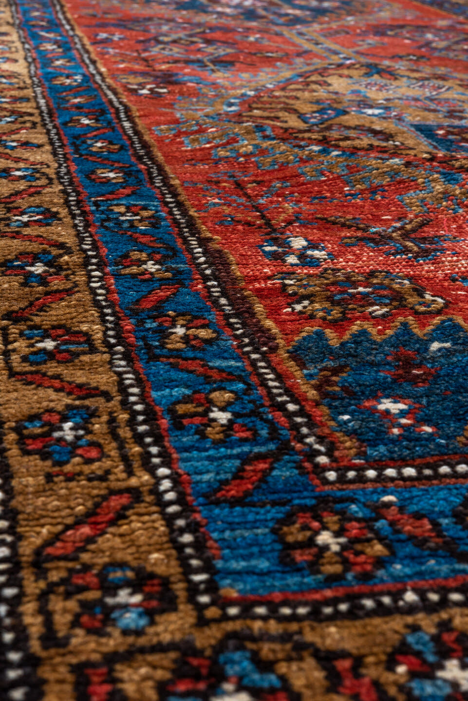 3' x 13' one-of-a-kind handmade vintage Heriz runner rug. Color palette: rust, navy, sky blue, camel, ivory, terracotta