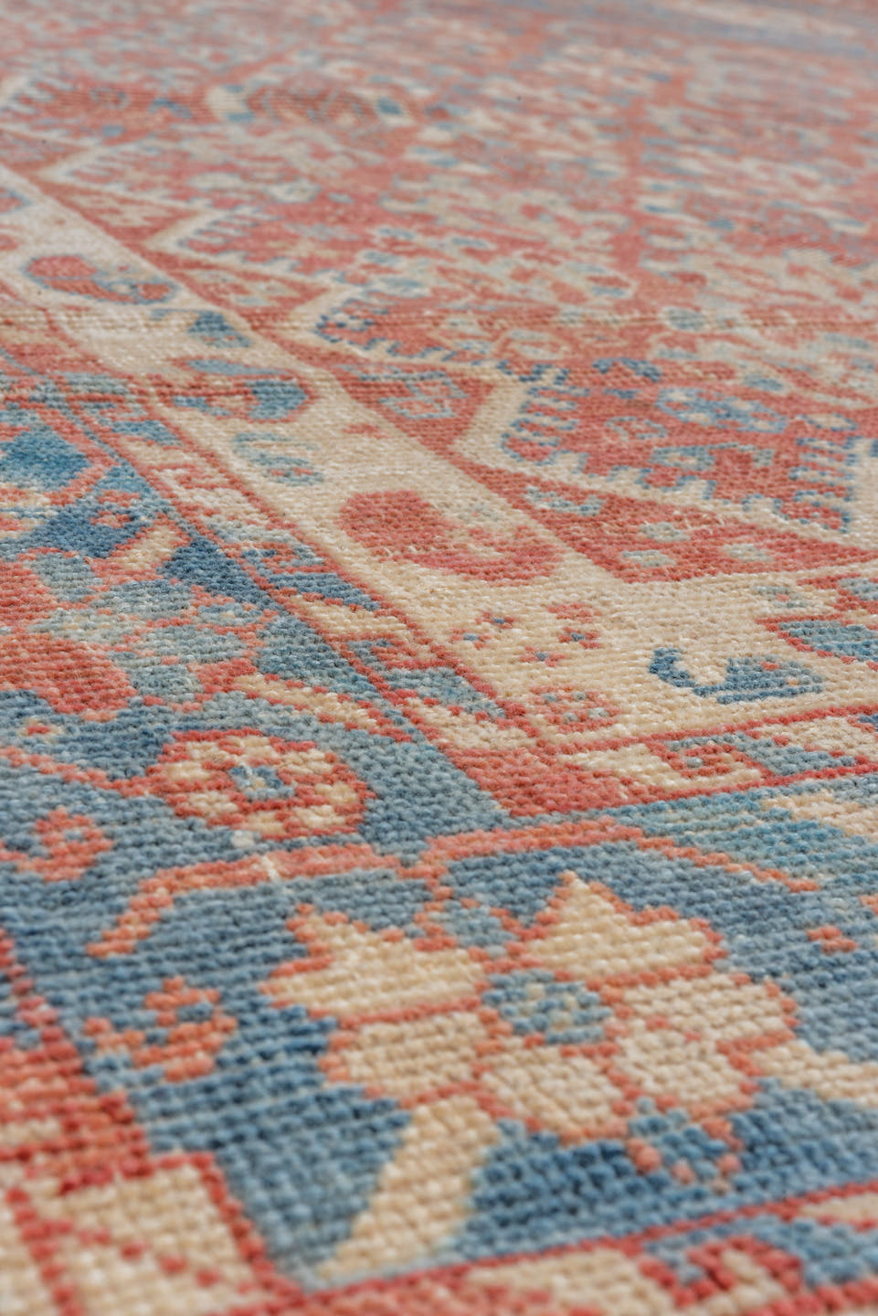 7' x 9' one-of-a-kind handmade vintage Shiraz rug. Color palette: terra cotta, ivory, sky blue, rust, beige, slate