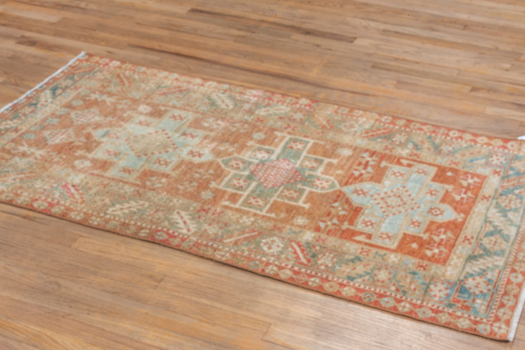3' x 5' one-of-a-kind handmade vintage Heriz small size rug. Color palette: terra cotta, ivory, pale blue, rust, camel, sage