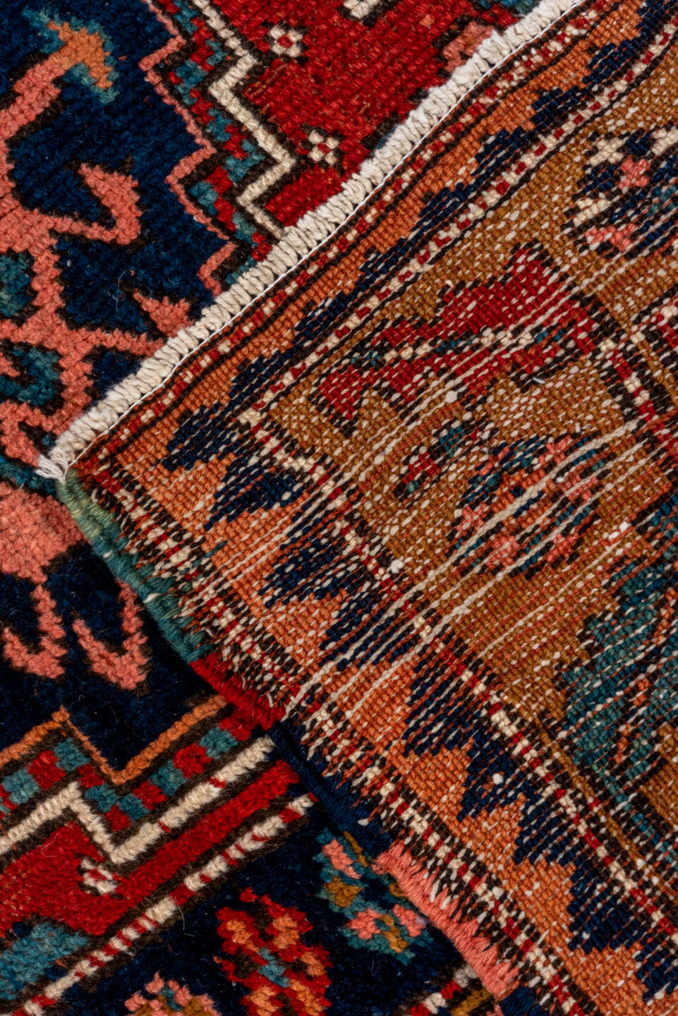 3' x 12' one-of-a-kind handmade vintage Heriz runner rug. Color palette: rust, navy, terra cotta, camel, ivory, teal, rose
