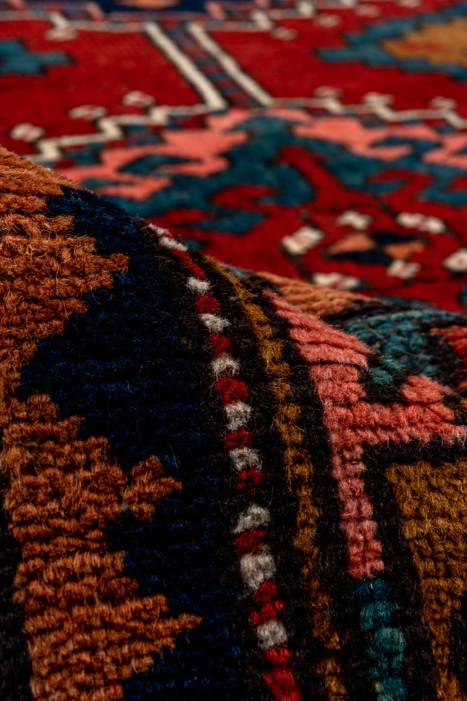 3' x 12' one-of-a-kind handmade vintage Heriz runner rug. Color palette: rust, navy, terra cotta, camel, ivory, teal, rose