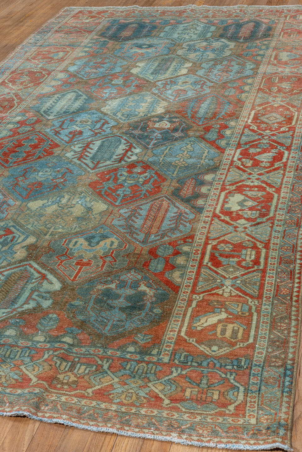 5' x 10' one-of-a-kind handmade vintage Baktiary runner rug. Color palette: rust, sky blue, ivory, camel, teal, terra cotta