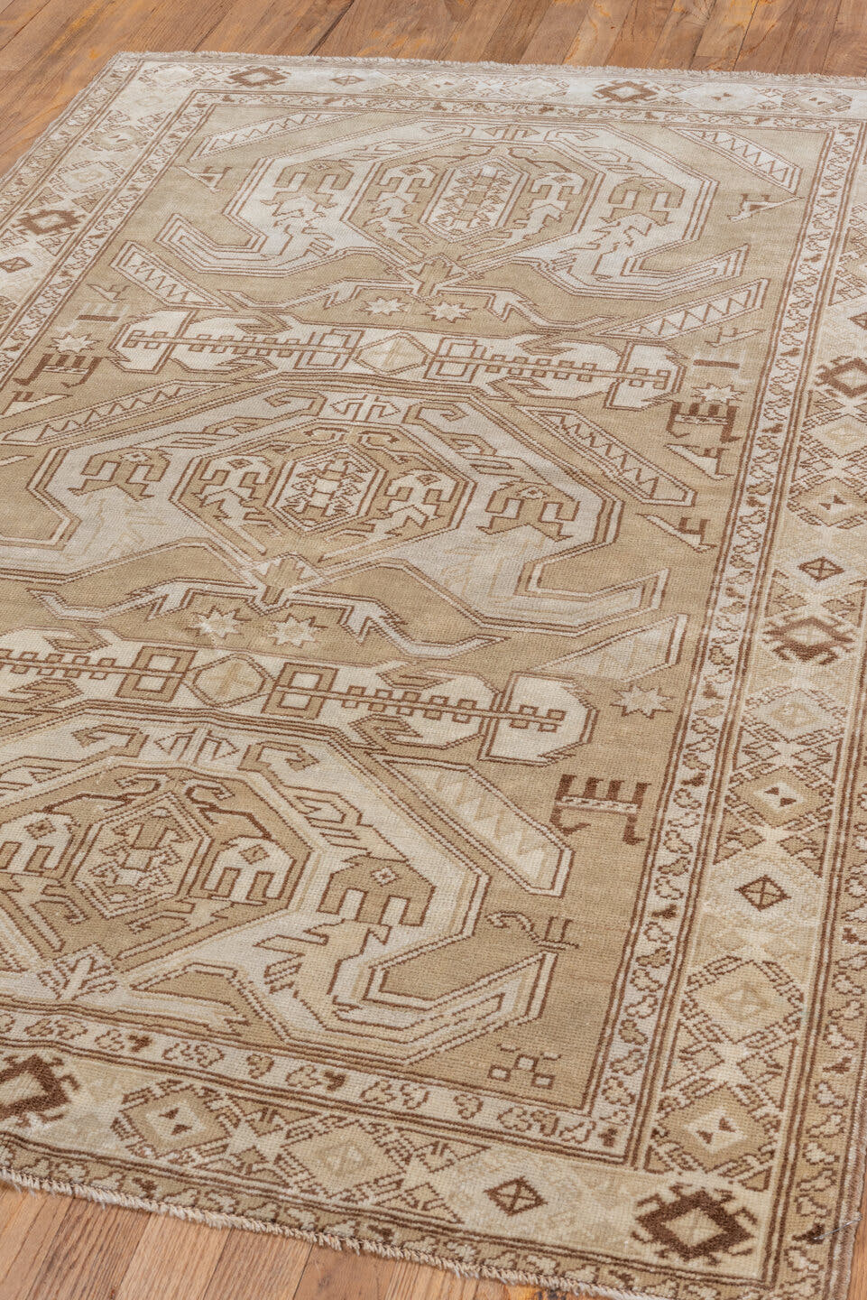 4' x 6' one-of-a-kind handmade vintage Caucasian small size rug. Color palette: ivory, camel, taupe, brown, sand, beige
