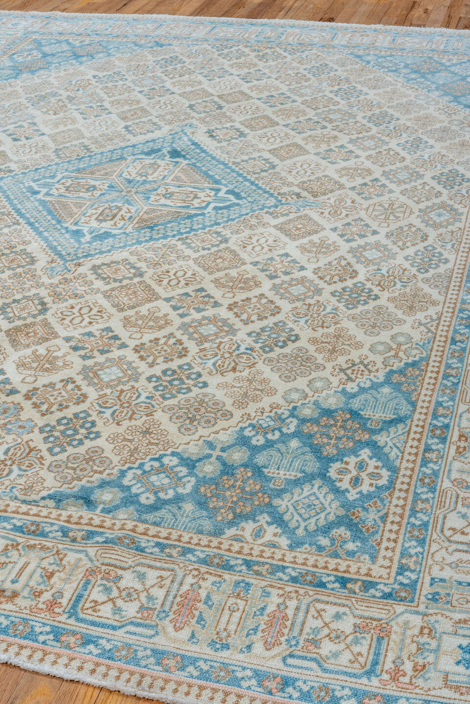 7' x 11' one-of-a-kind handmade vintage Joshegan large size rug. Color palette: ivory, sky blue, taupe, beige, camel