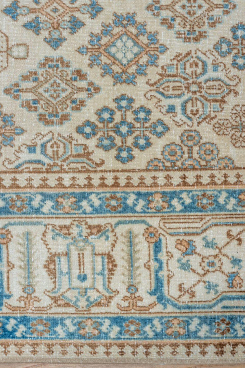 7' x 11' one-of-a-kind handmade vintage Joshegan large size rug. Color palette: ivory, sky blue, taupe, beige, camel