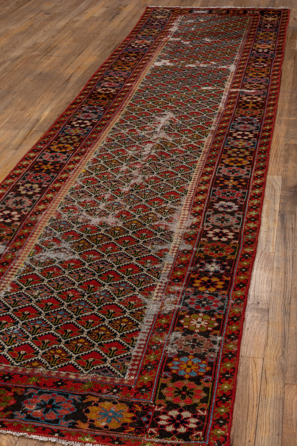 3' x 13' one-of-a-kind handmade vintage Malayer runner rug. Color palette: black, brown, gray, maroon, pink, red