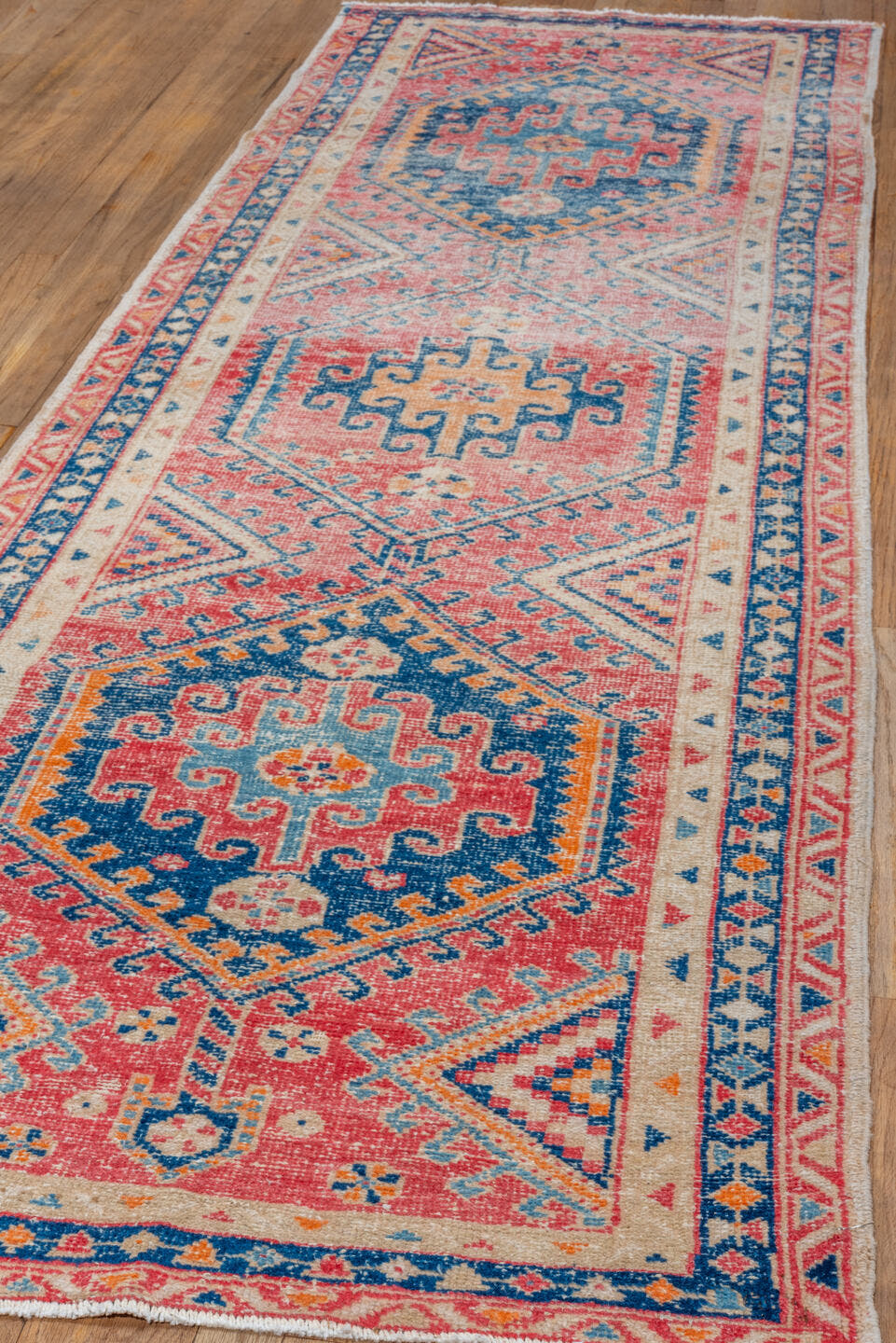 3' x 9' one-of-a-kind handmade vintage Heriz runner rug. Color palette: coral, ivory, navy, sky_blue, rose, saffron