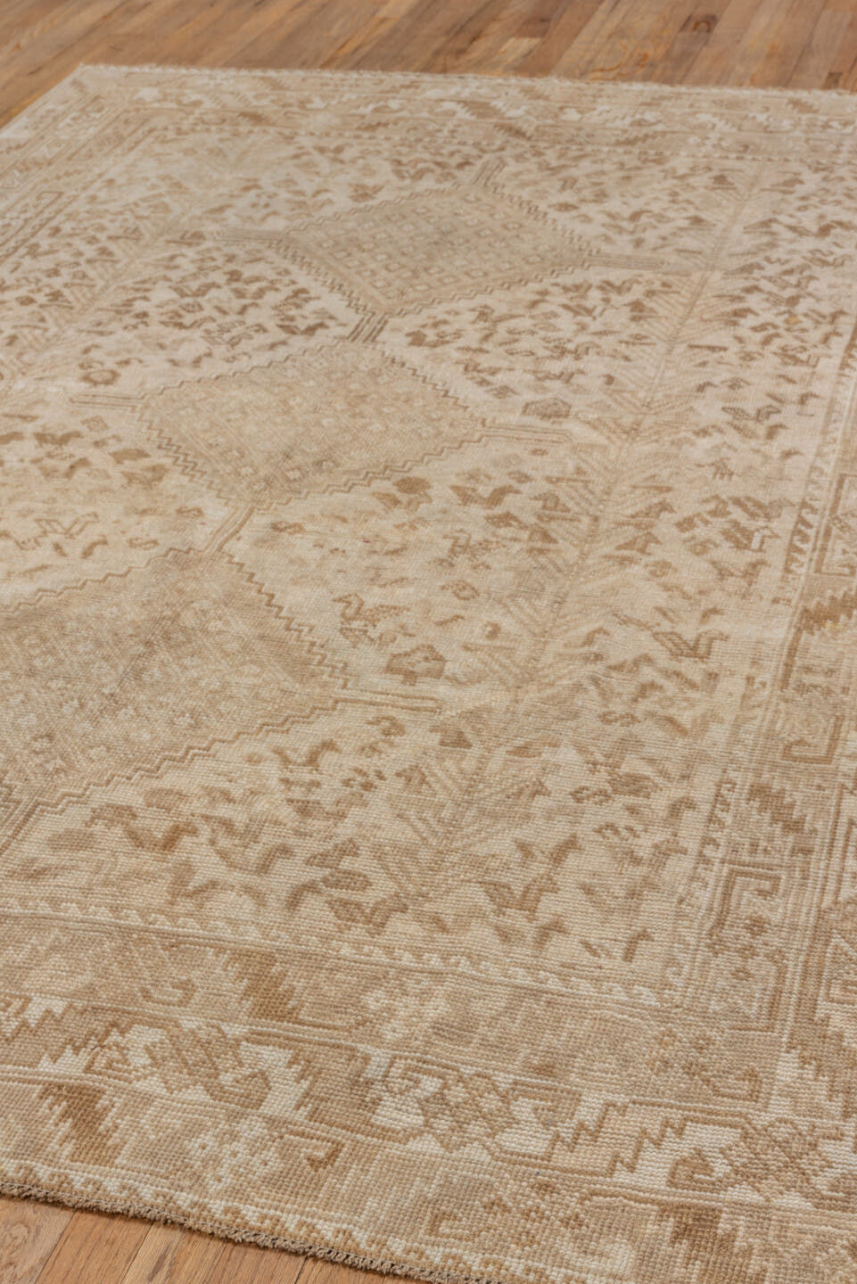 5' x 8' one-of-a-kind handmade vintage Shiraz medium size rug. Color palette: beige, ivory, taupe, camel, sand, light brown