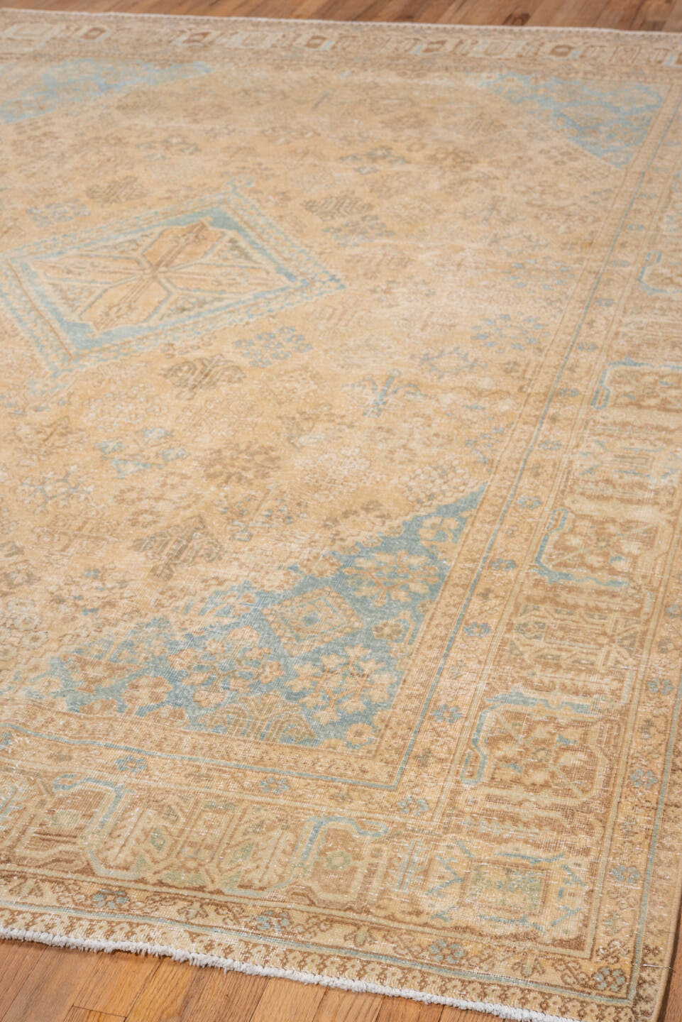 7' x 10' one-of-a-kind handmade vintage Joshegan large size rug. Color palette: camel, ivory, sky_blue, taupe, tan