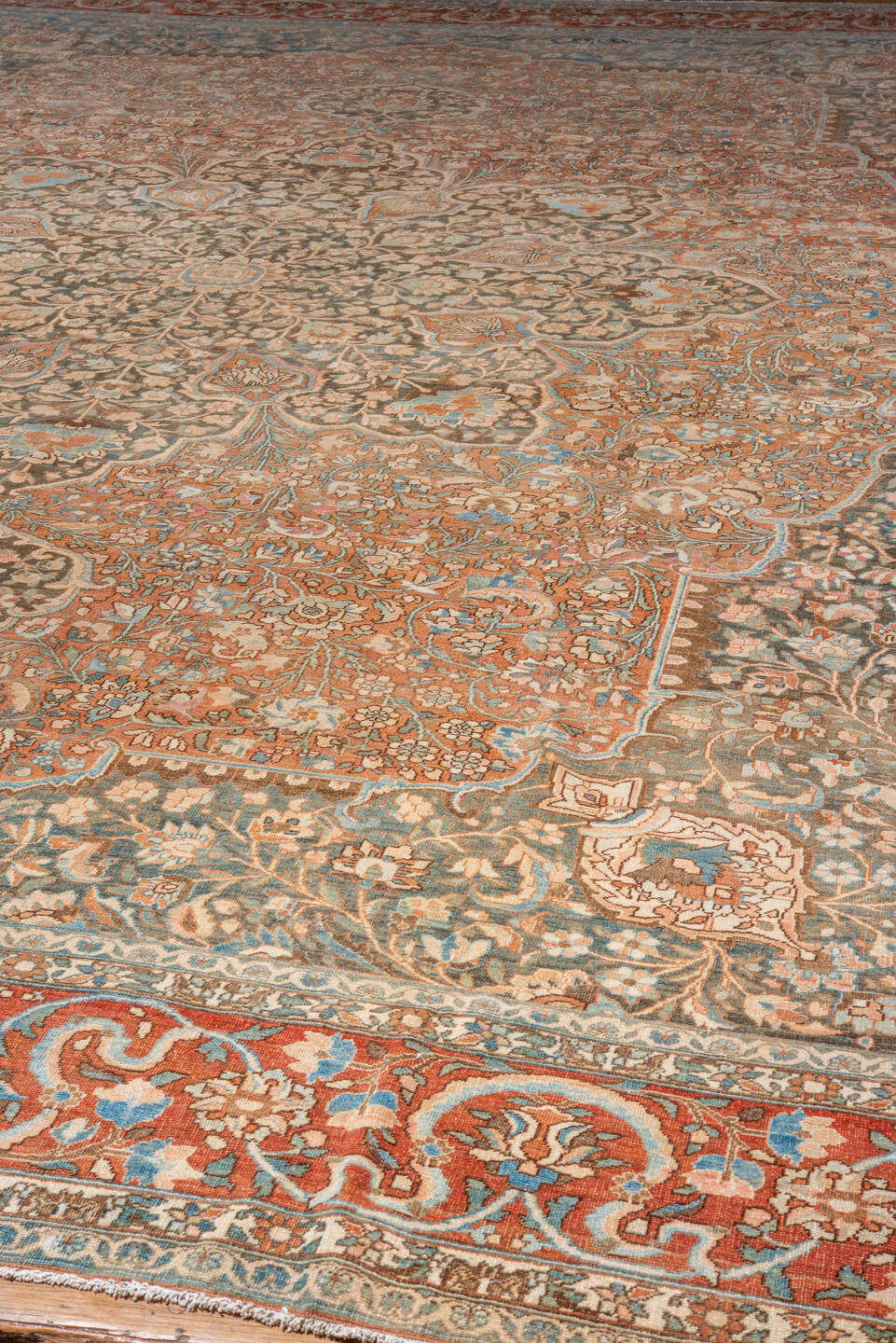 12' x 17' one-of-a-kind handmade vintage Baktiary oversize rug. Color palette: rust, charcoal, sky blue, ivory, taupe, camel