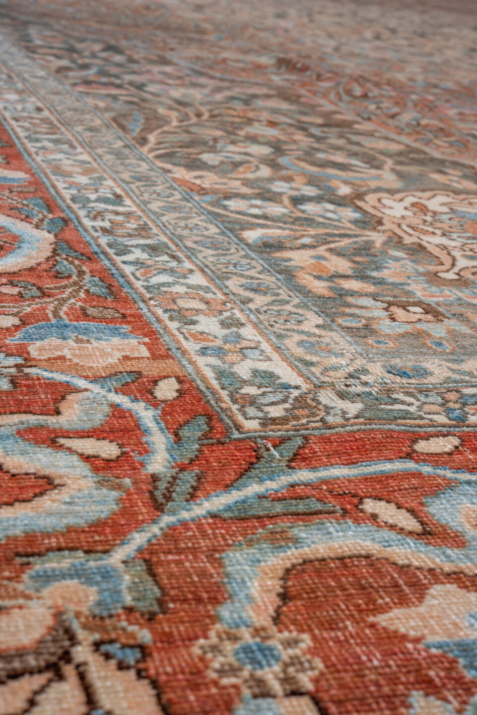 12' x 17' one-of-a-kind handmade vintage Baktiary oversize rug. Color palette: rust, charcoal, sky blue, ivory, taupe, camel