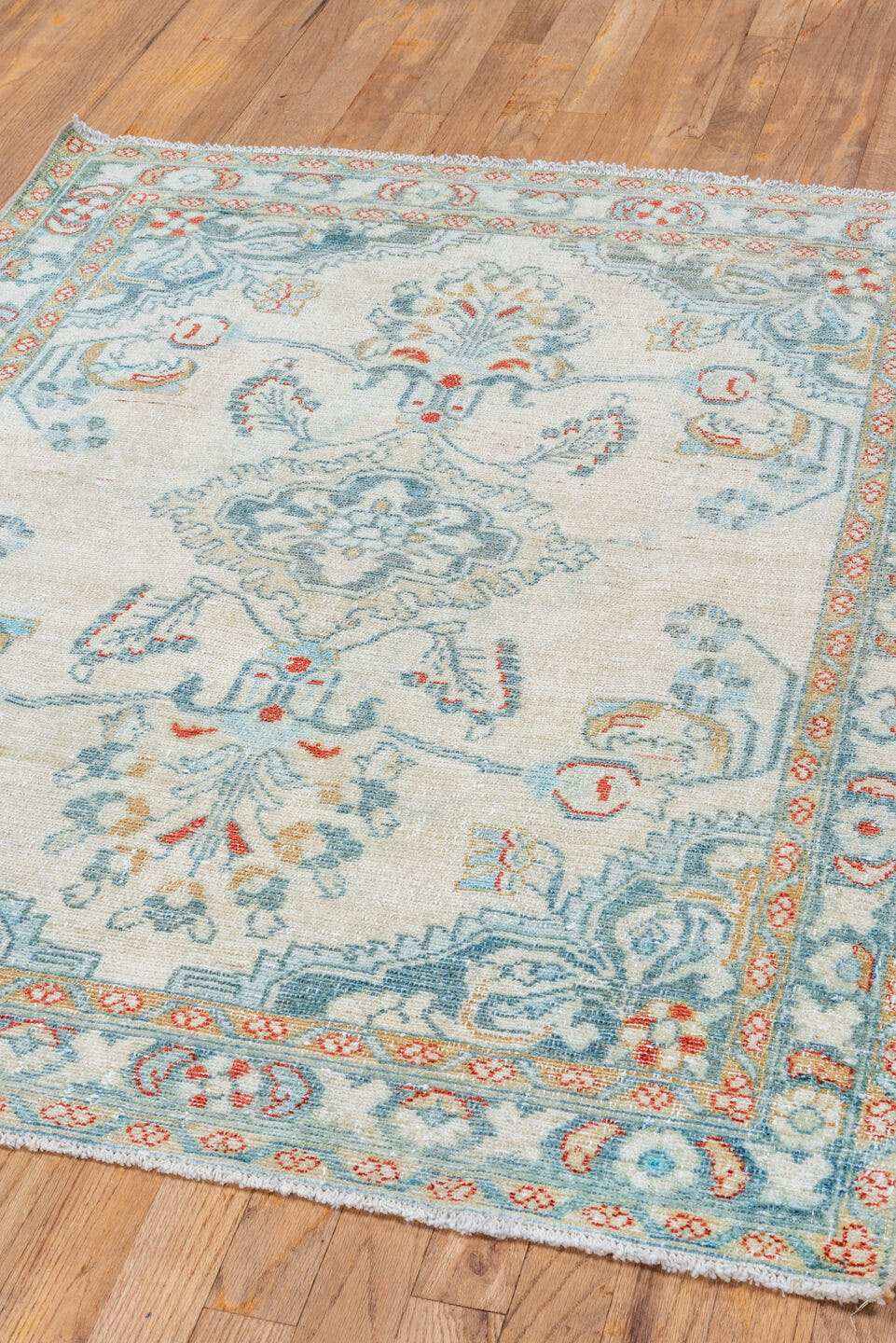 3' x 4' one-of-a-kind handmade vintage Lilian small size rug. Color palette: ivory, pale blue, sky blue, coral, gold
