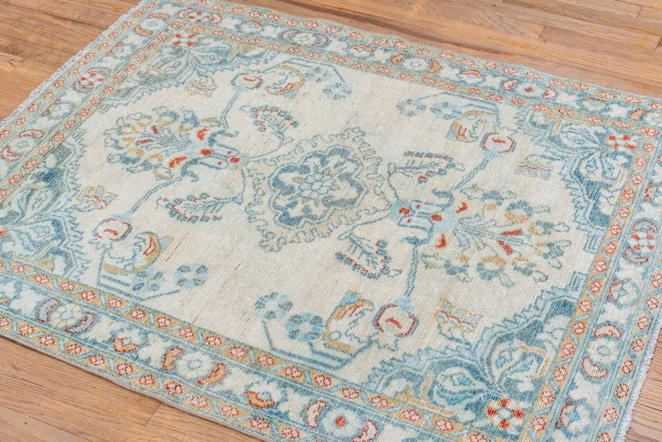 3' x 4' one-of-a-kind handmade vintage Lilian small size rug. Color palette: ivory, pale blue, sky blue, coral, gold
