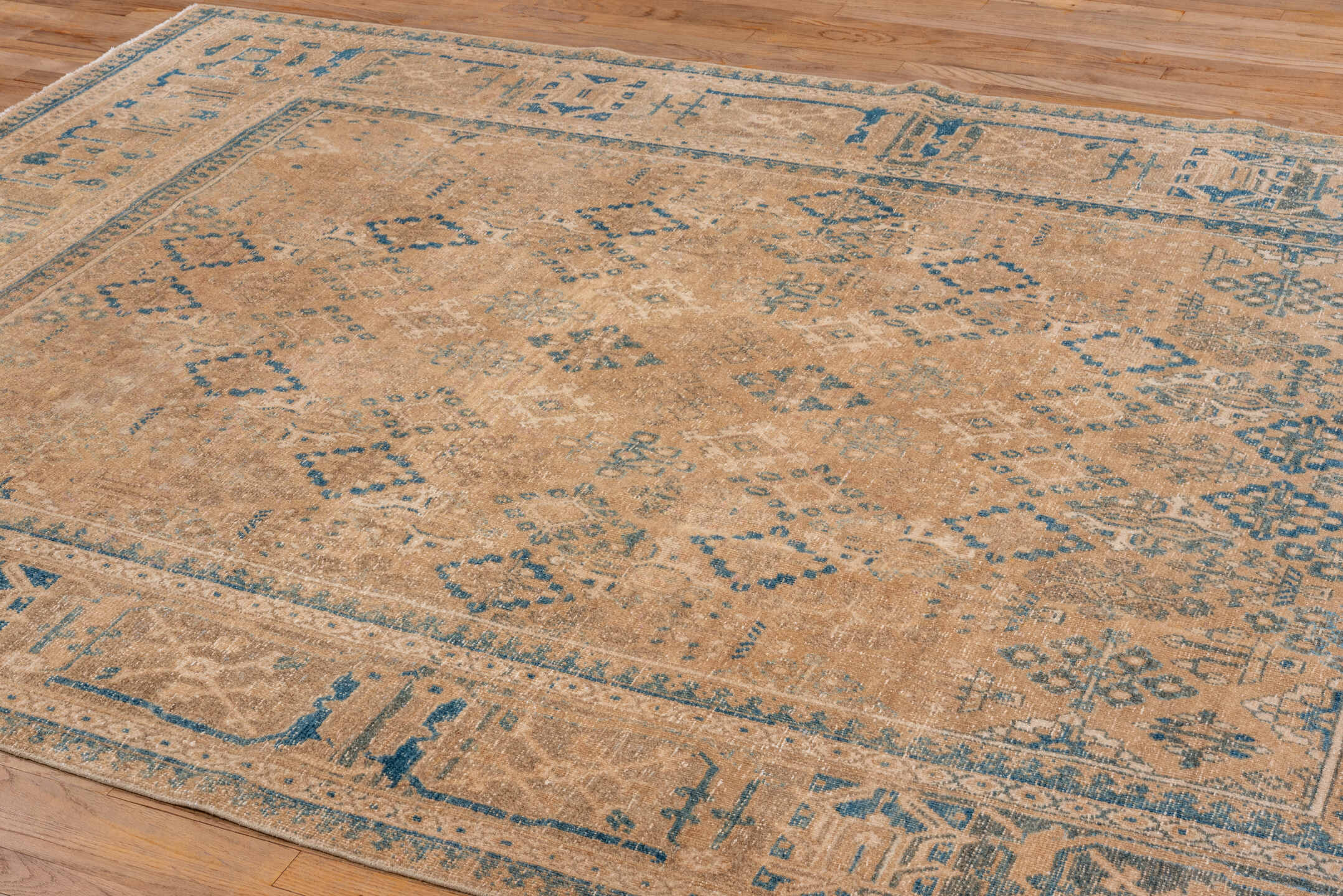 6' x 10' one-of-a-kind handmade vintage Joshegan large size rug. Color palette: camel, ivory, sky blue, taupe, beige