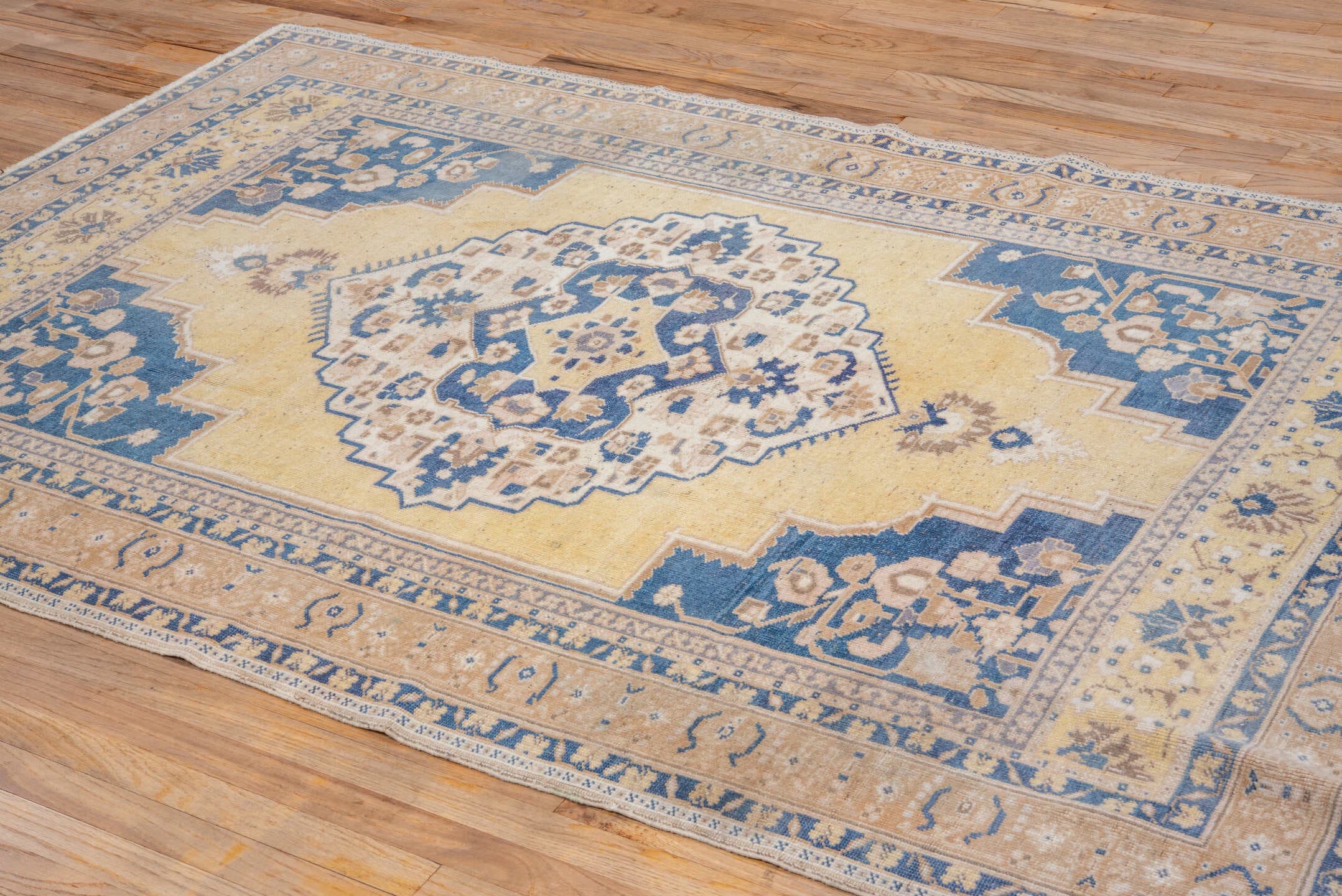 5' x 8' one-of-a-kind handmade vintage Oushak medium size rug. Color palette: ivory, blue, pale yellow, beige, taupe, gold
