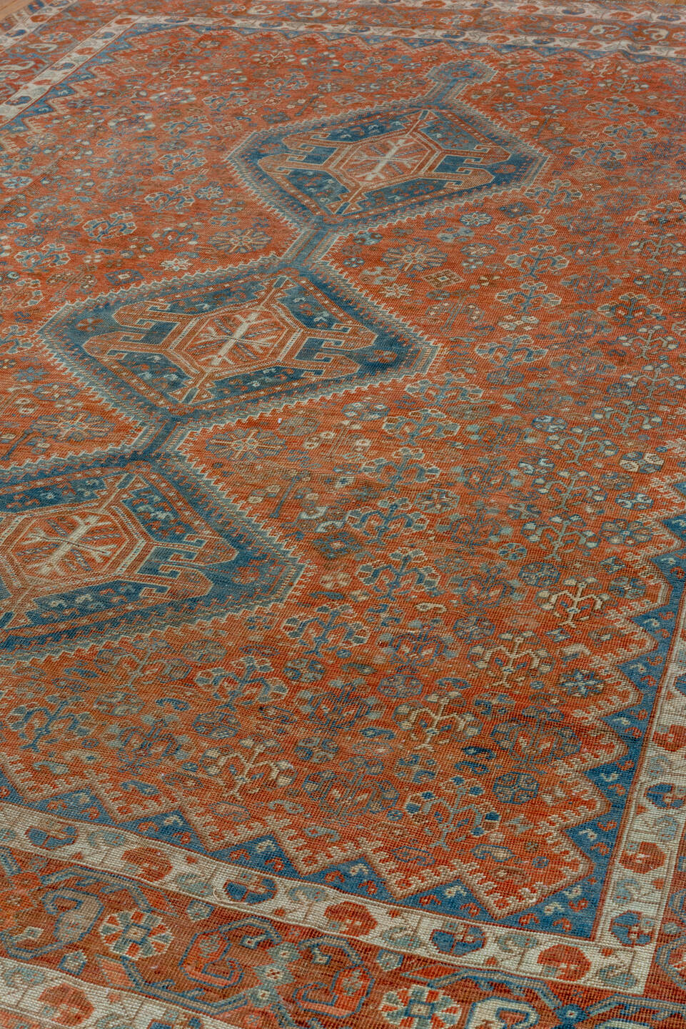 7' x 10' one-of-a-kind handmade vintage Shiraz large size rug. Color palette: terra cotta, ivory, slate, rust, blue, camel