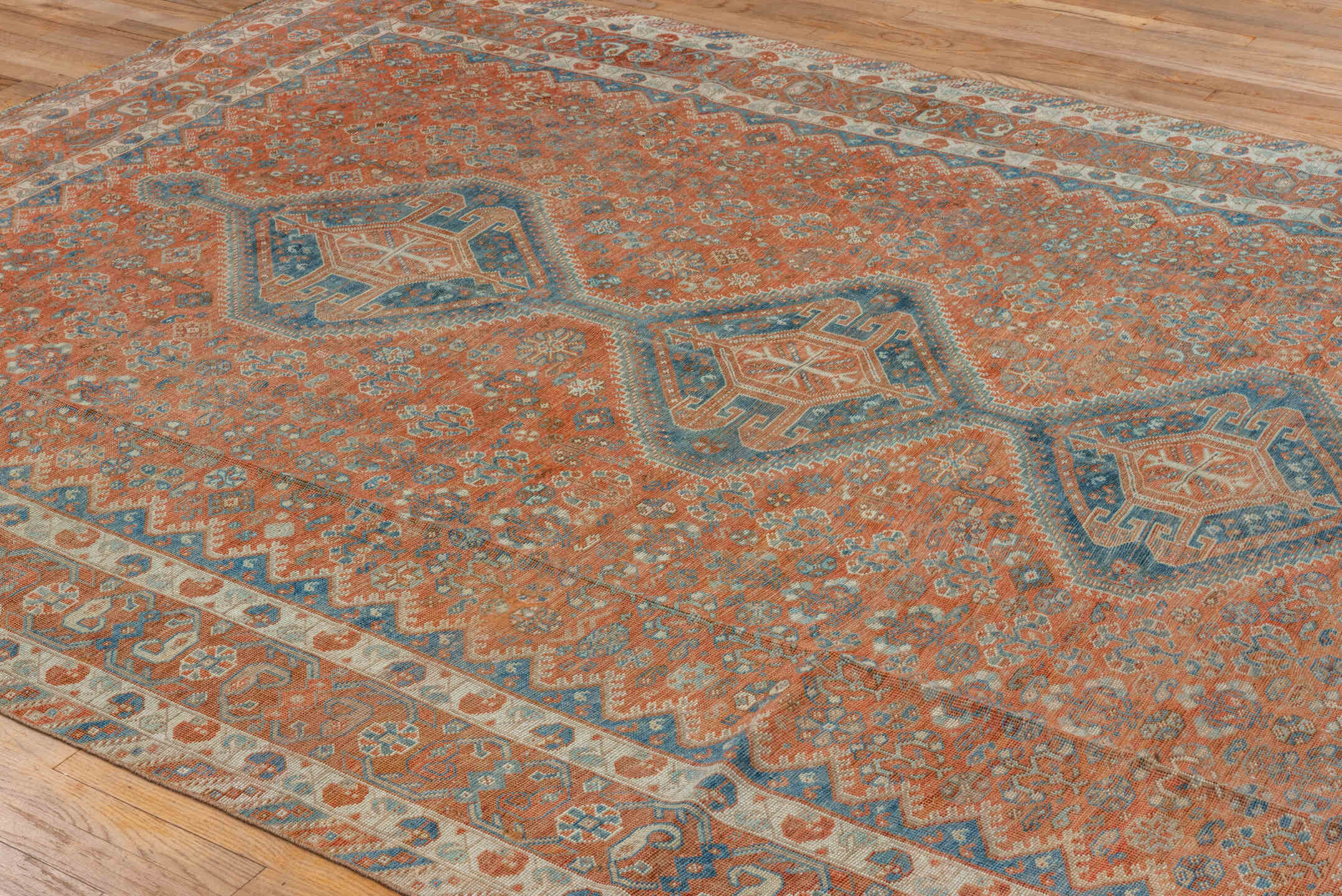 7' x 10' one-of-a-kind handmade vintage Shiraz large size rug. Color palette: terra cotta, ivory, slate, rust, blue, camel