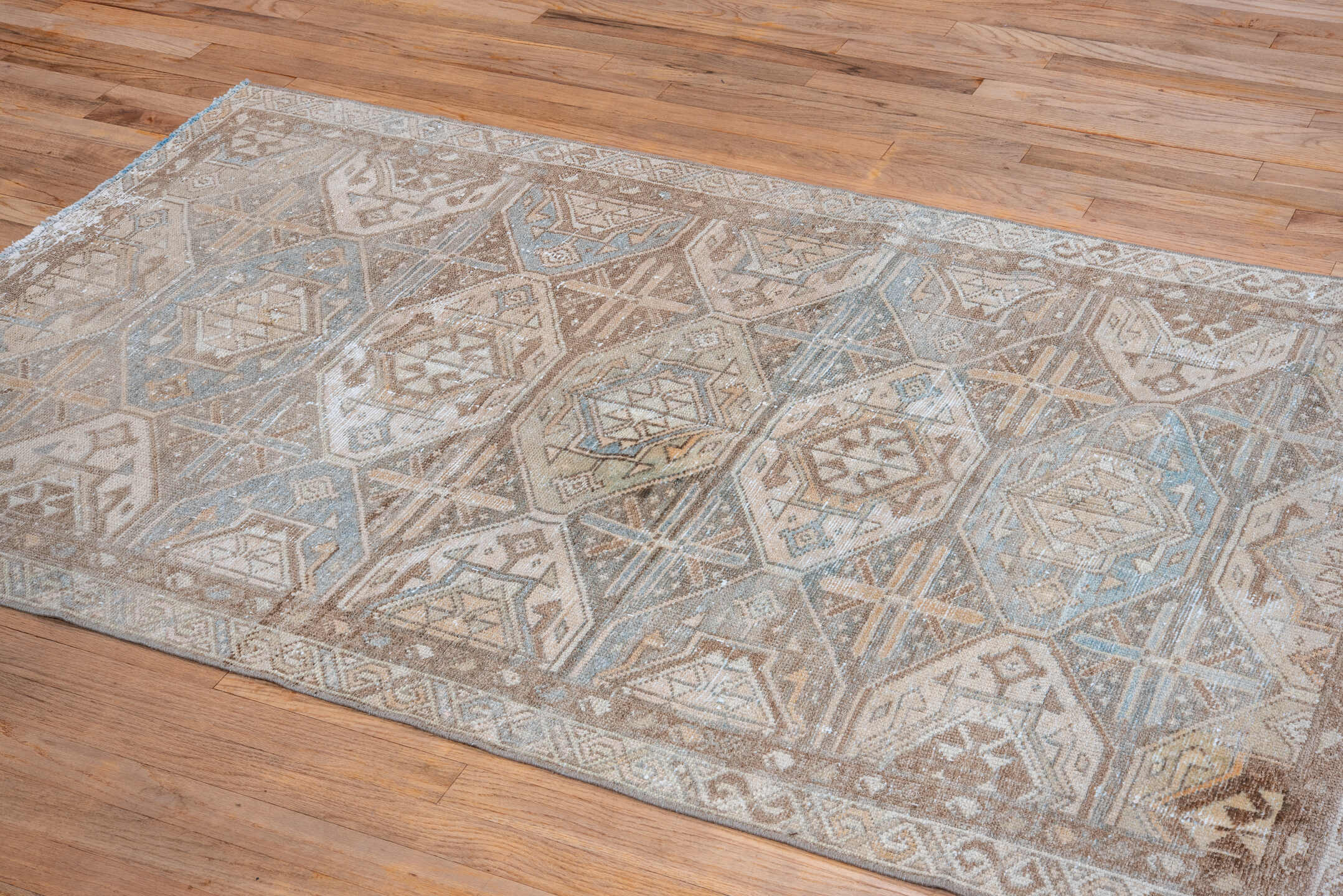 3' x 6' one-of-a-kind handmade vintage Baktiary small size rug. Color palette: taupe, ivory, sky blue, camel, brown, sand