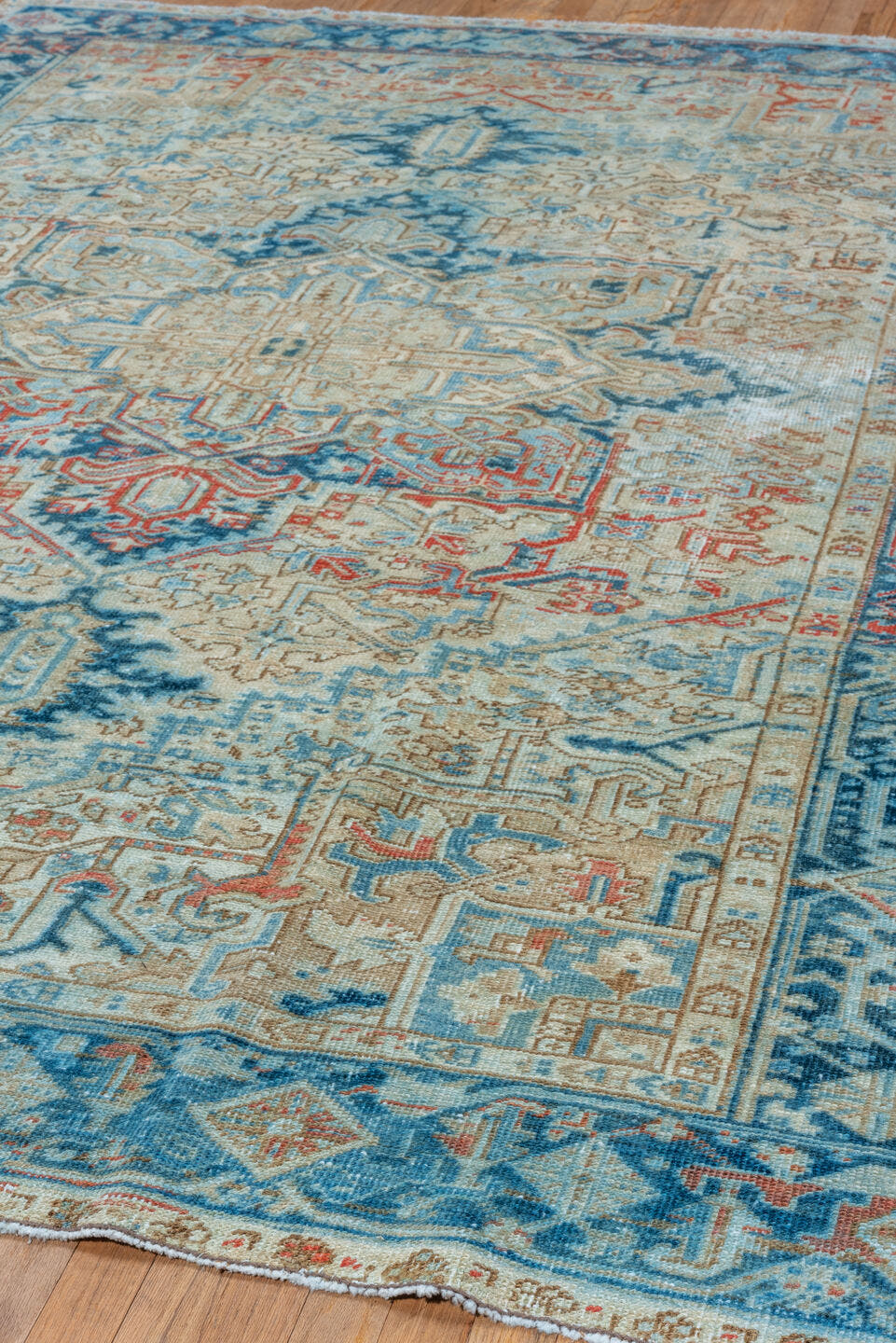 6' x 9' one-of-a-kind handmade vintage Heriz medium size rug. Color palette: ivory, sky blue, navy, rust, beige, camel