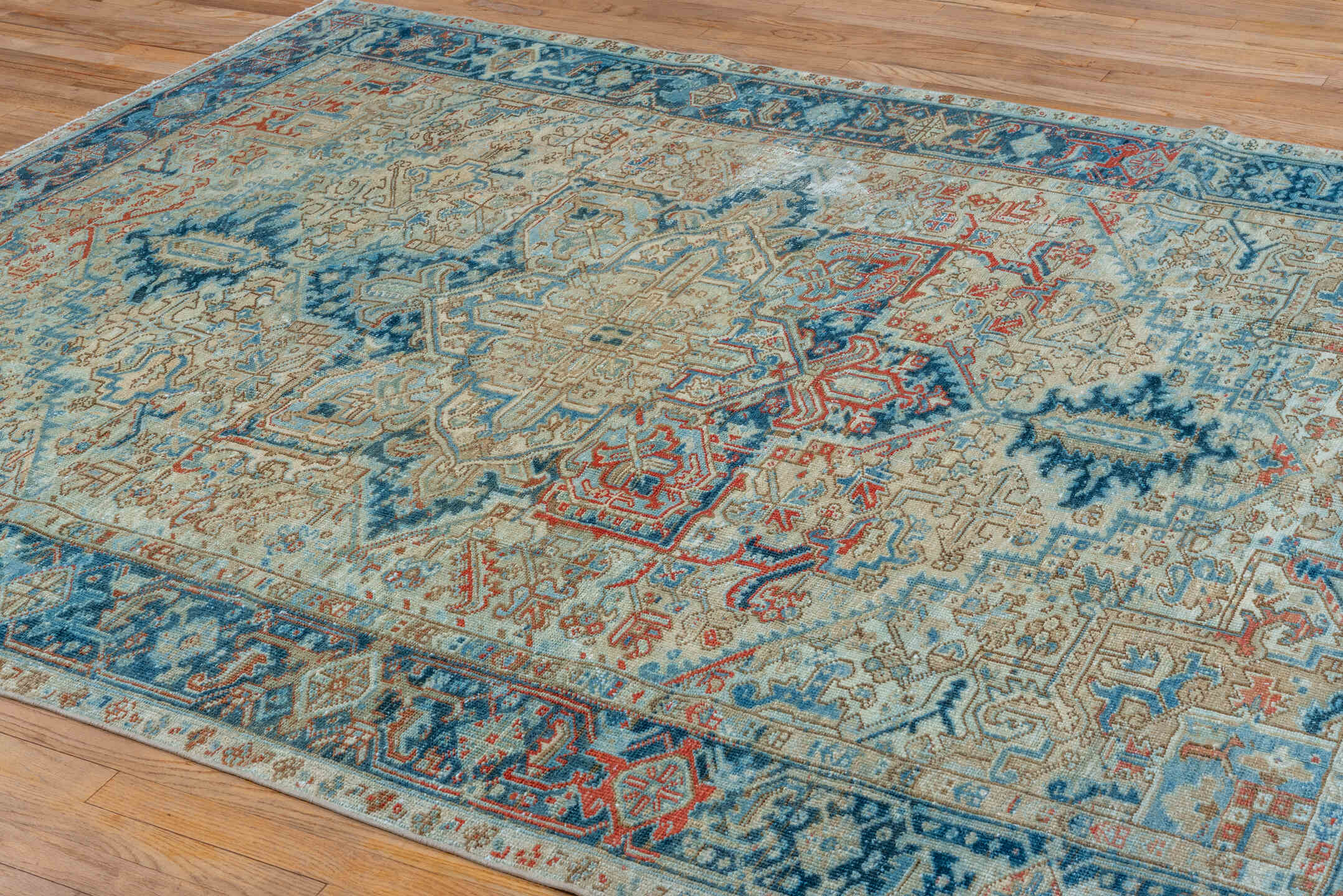 6' x 9' one-of-a-kind handmade vintage Heriz medium size rug. Color palette: ivory, sky blue, navy, rust, beige, camel