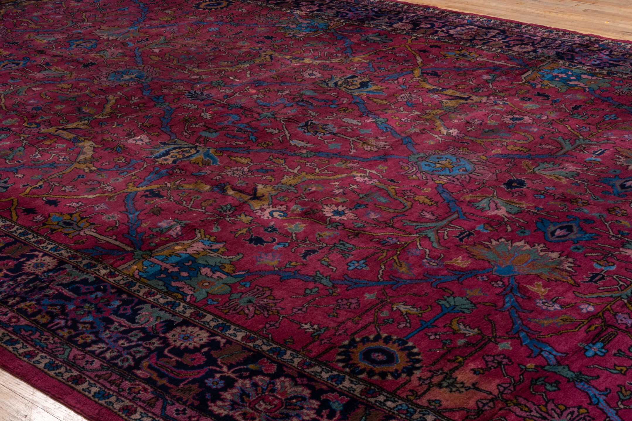11' x 20' one-of-a-kind handmade vintage Agra oversize rug. Color palette: raspberry, navy, sky blue, rose, gold, burgundy