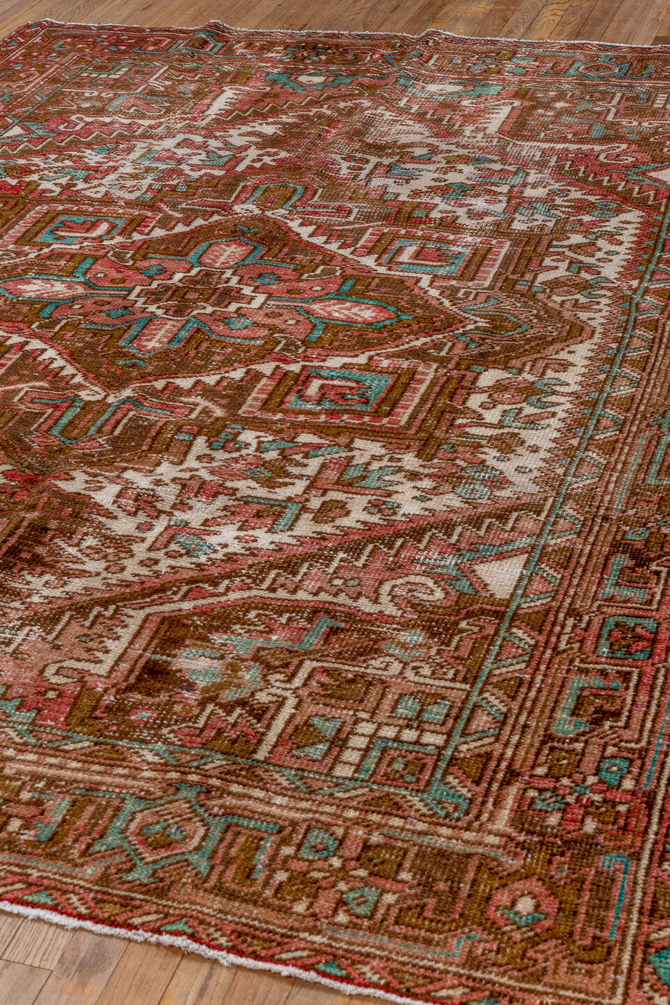 6' x 8' one-of-a-kind handmade vintage Heriz medium size rug. Color palette: rust, brown, ivory, turquoise, rose, terracotta