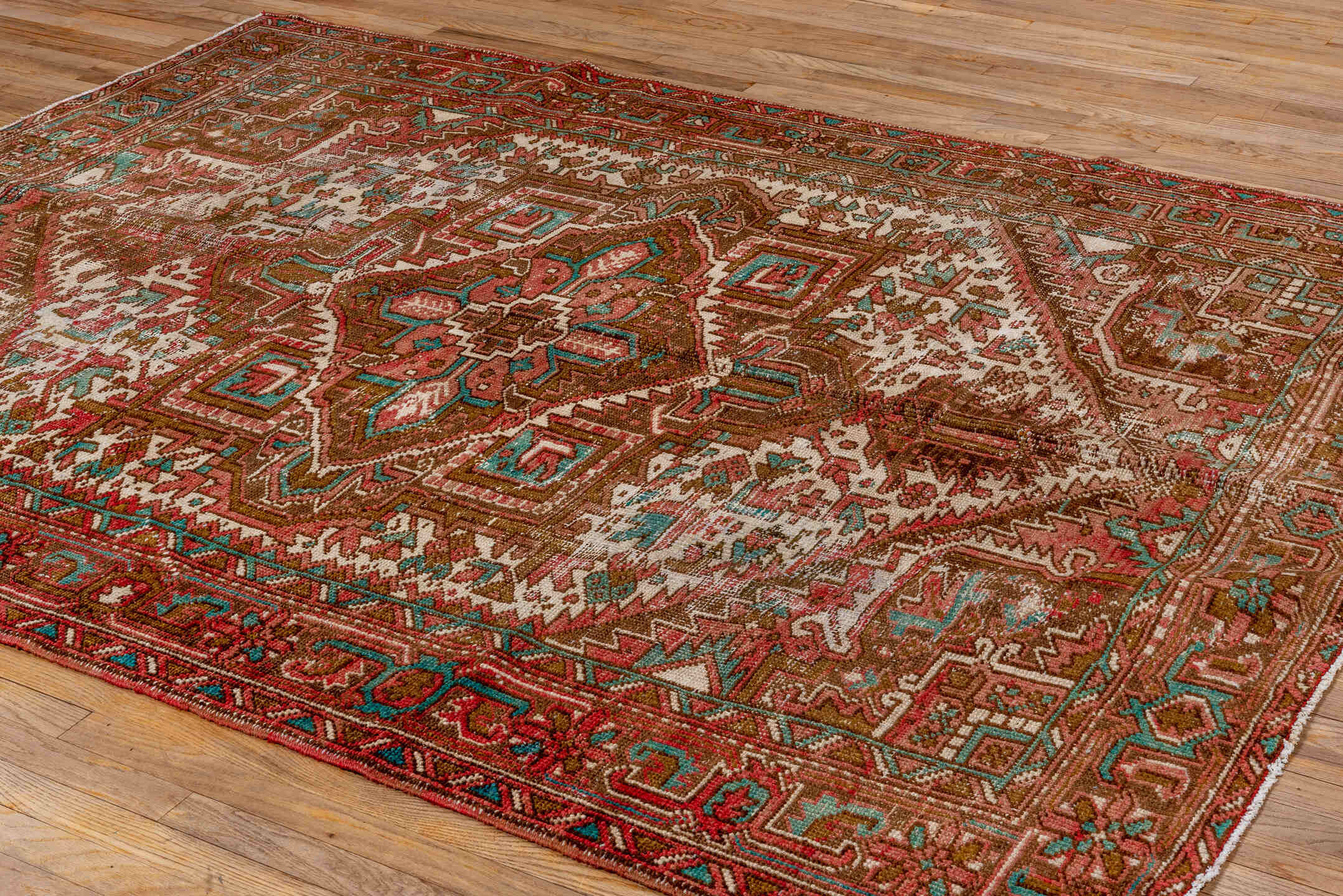 6' x 8' one-of-a-kind handmade vintage Heriz medium size rug. Color palette: rust, brown, ivory, turquoise, rose, terracotta