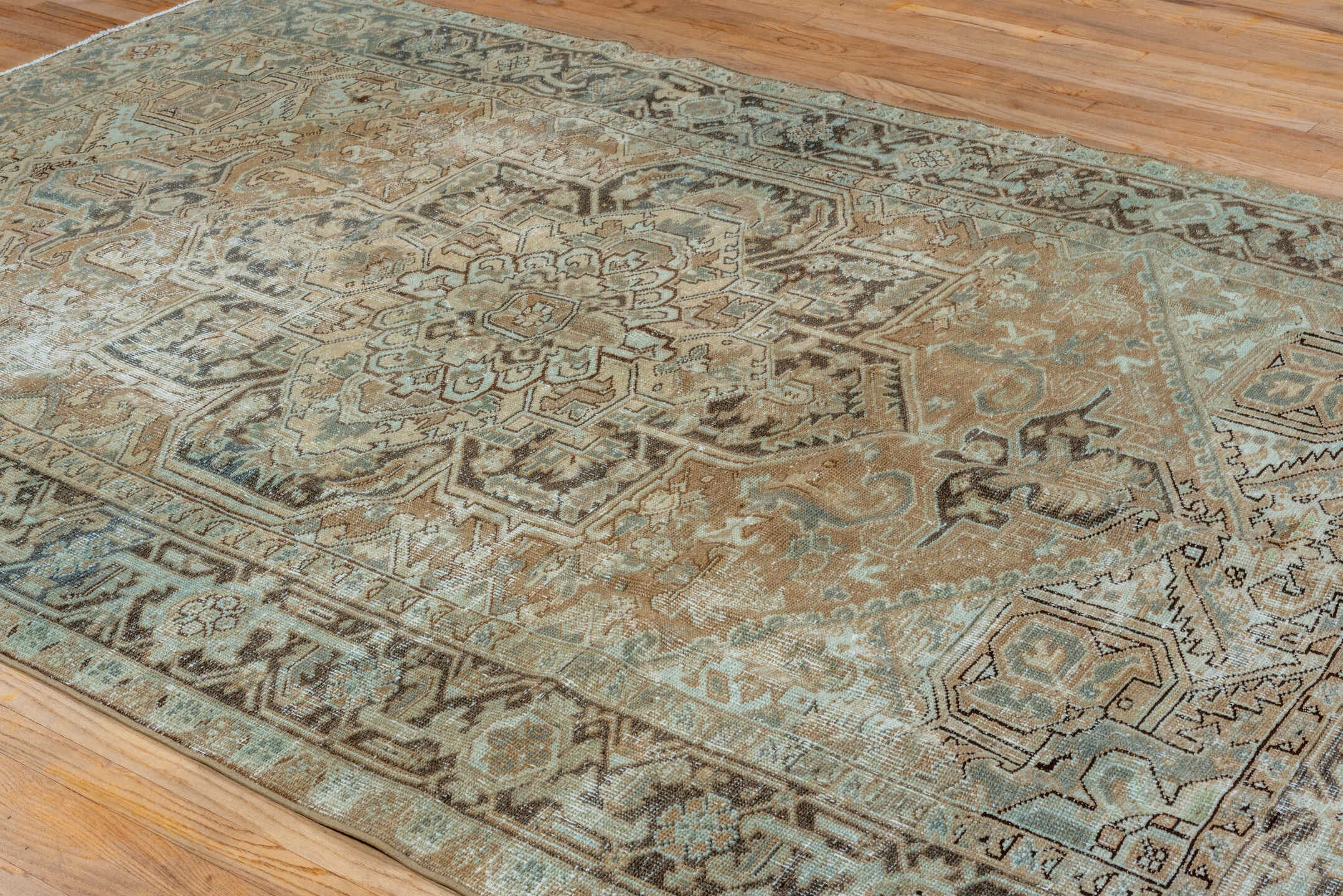 6' x 9' one-of-a-kind handmade vintage Heriz medium size rug. Color palette: camel, ivory, pale blue, taupe, charcoal, beige